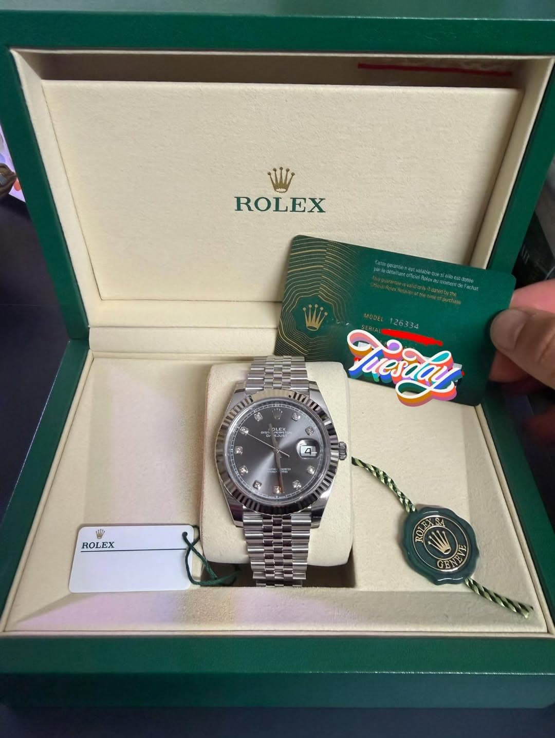 May be an image of wrist watch and text