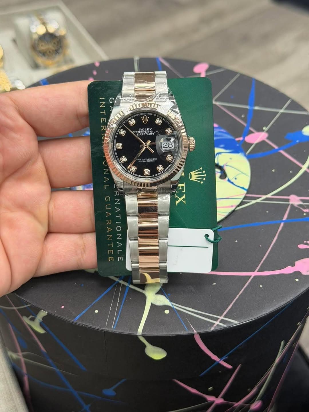 May be an image of wrist watch and text