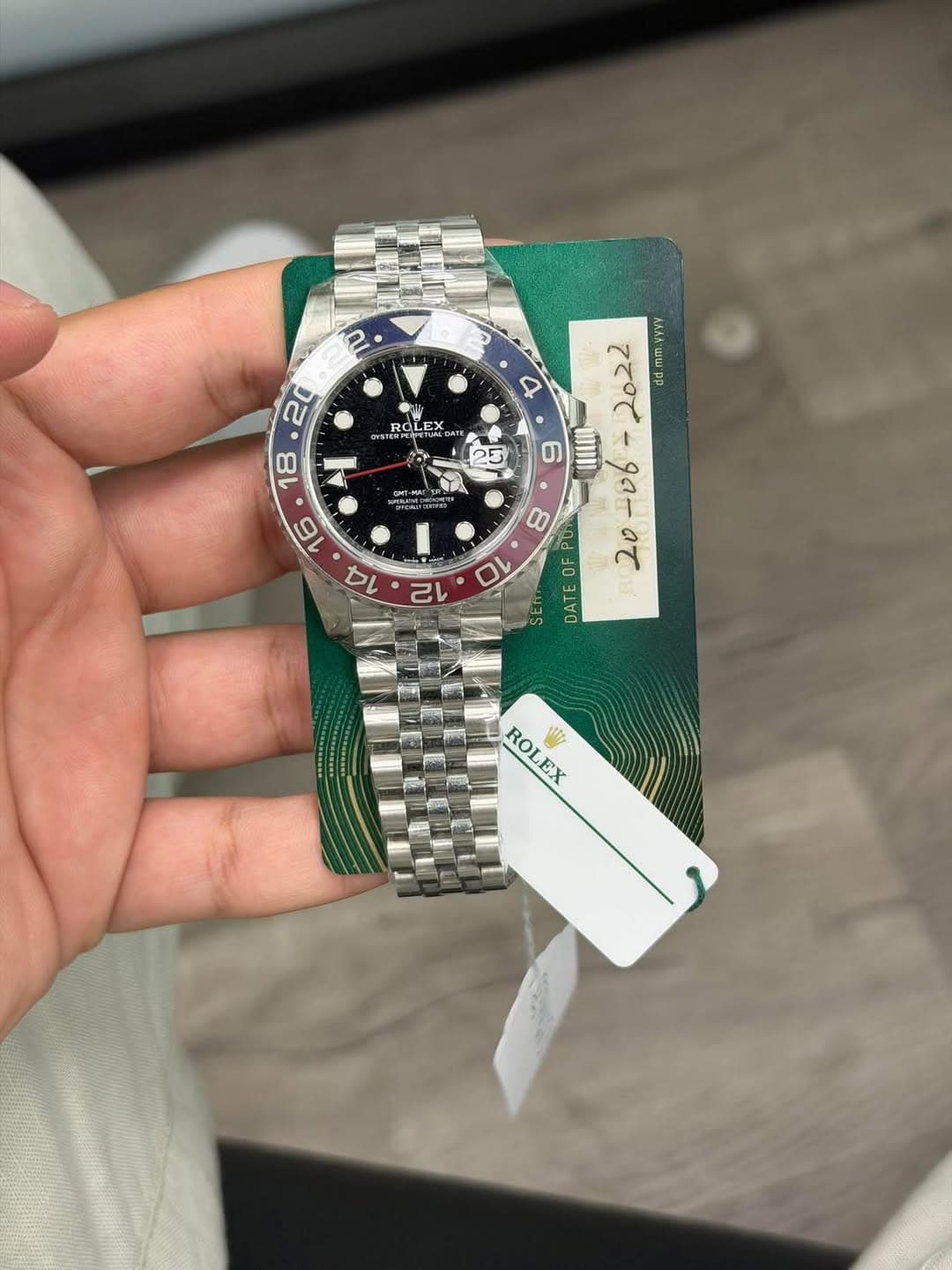 May be an image of wrist watch and text