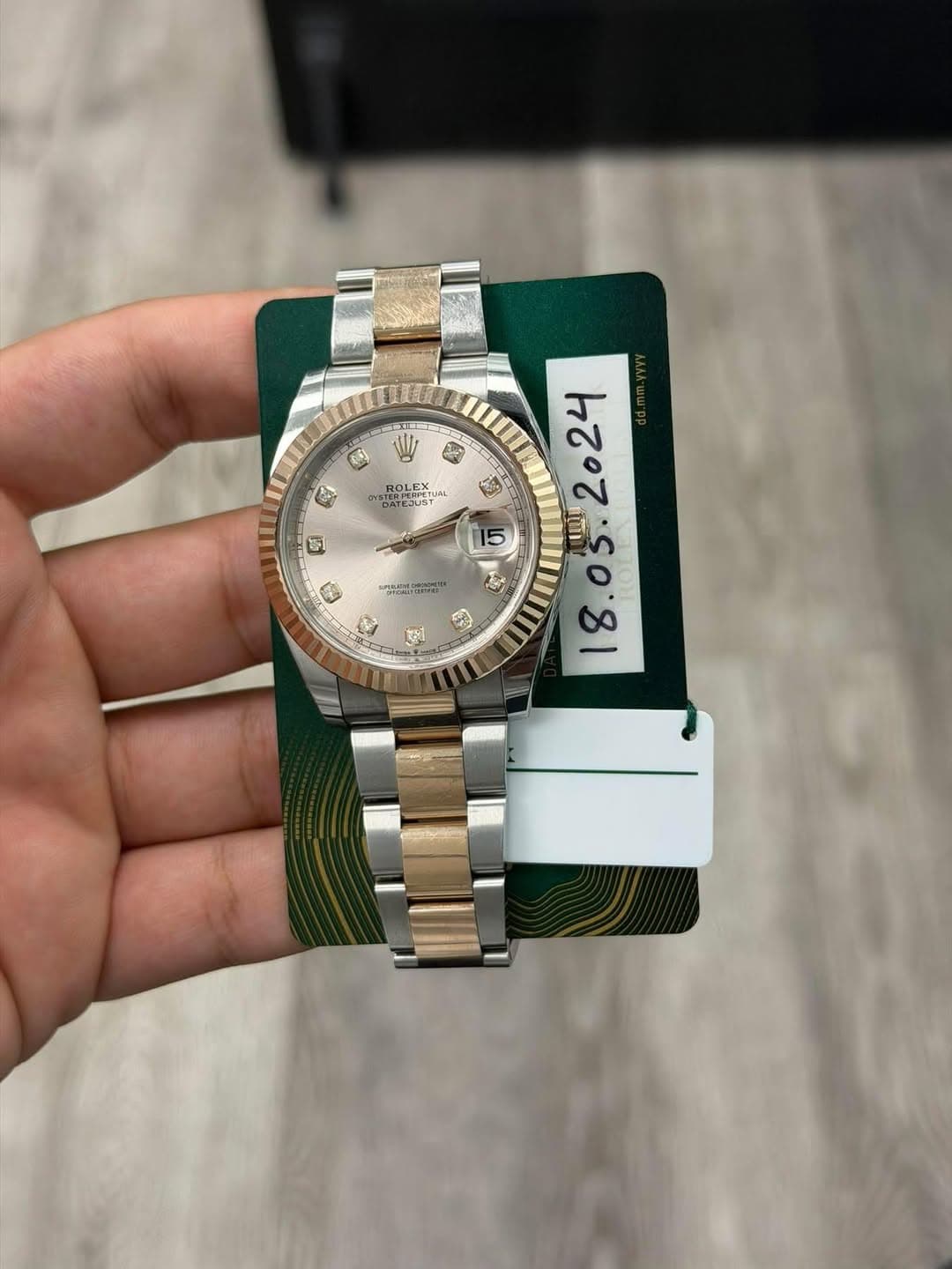 May be an image of wrist watch and text