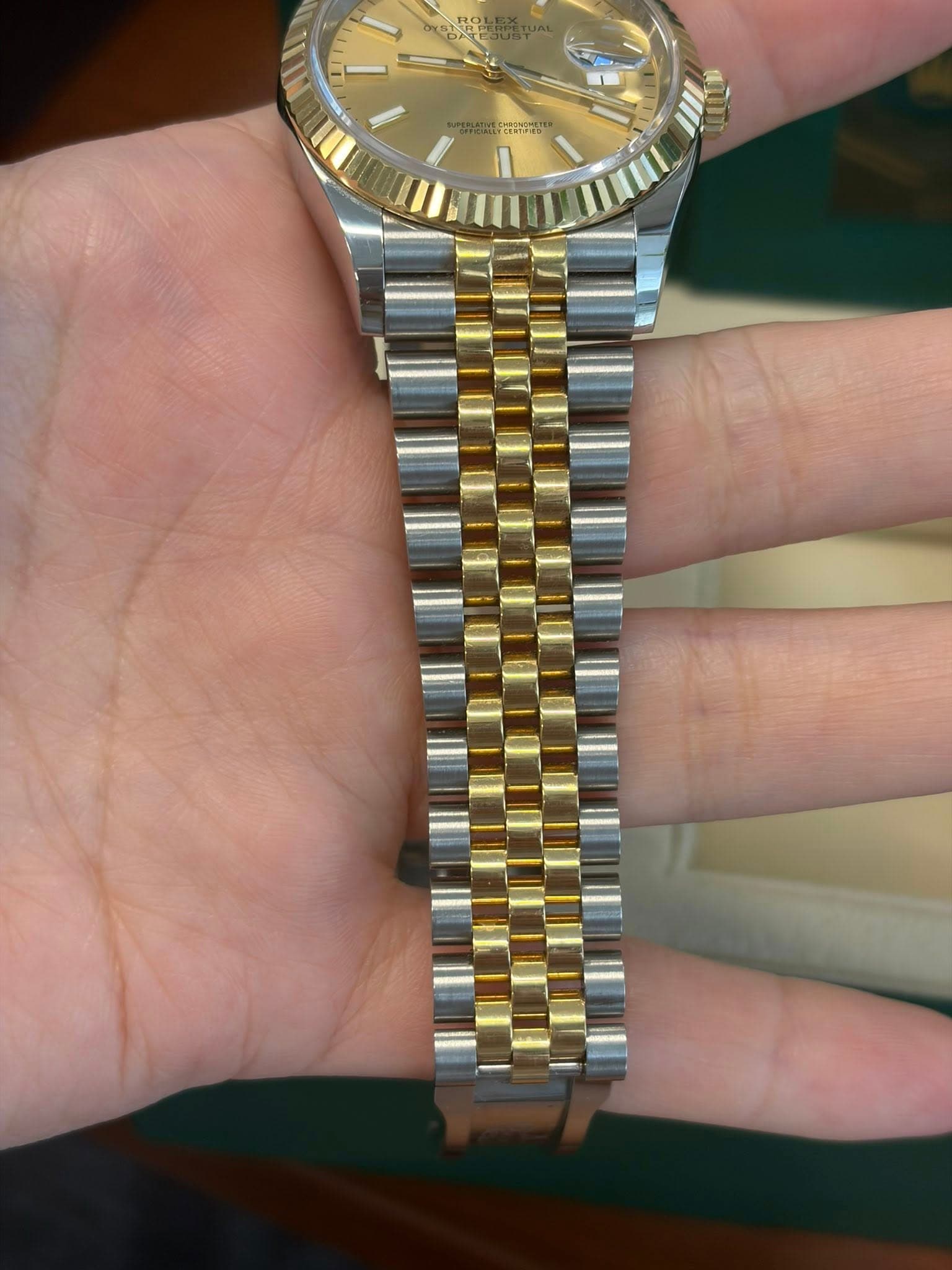May be an image of wrist watch and text