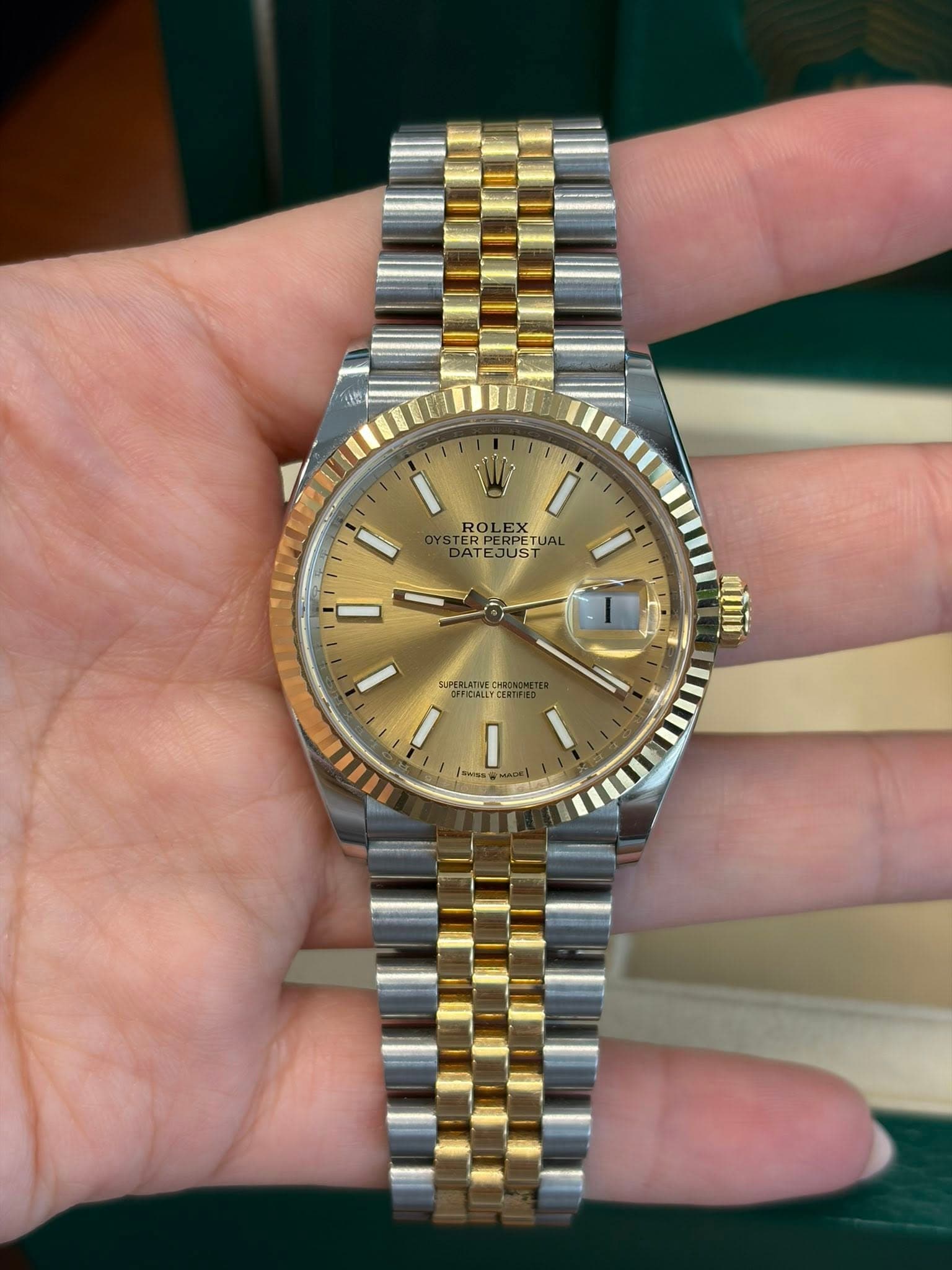 May be an image of wrist watch and text