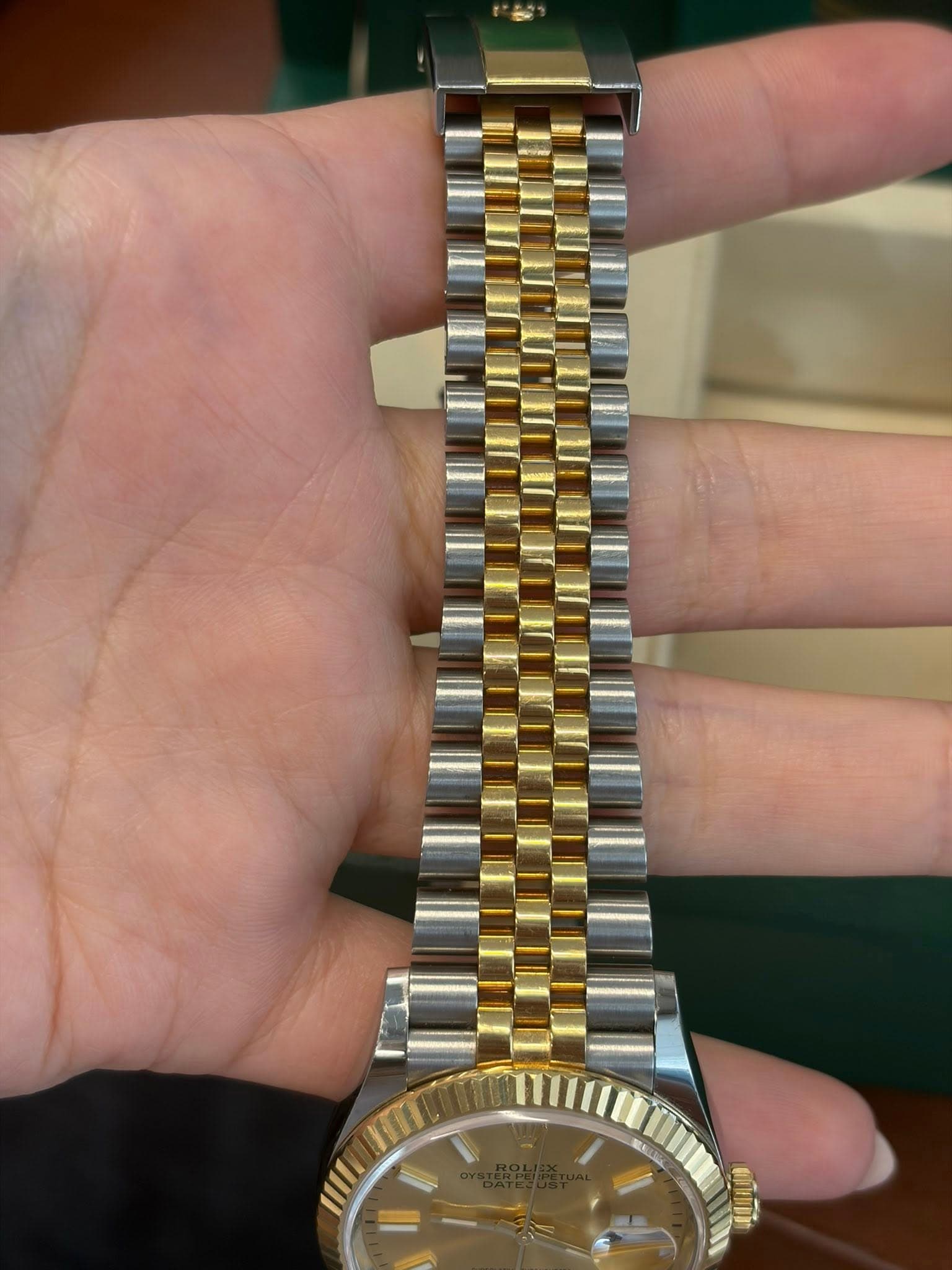 May be an image of wrist watch and text