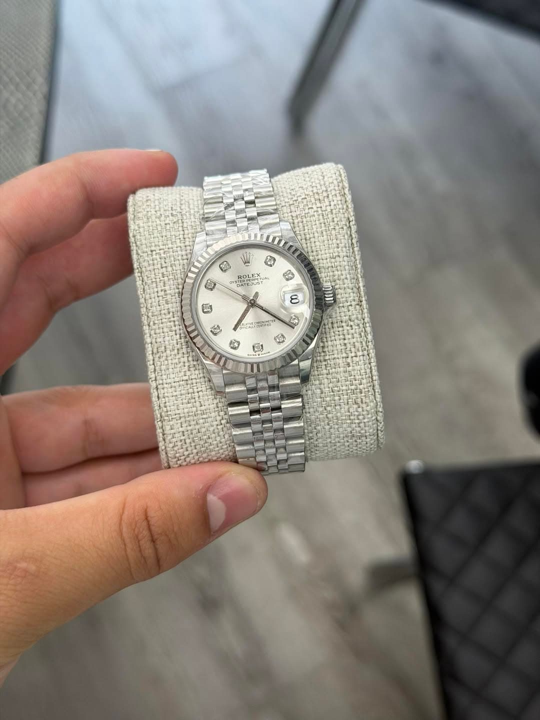 May be an image of wrist watch and text
