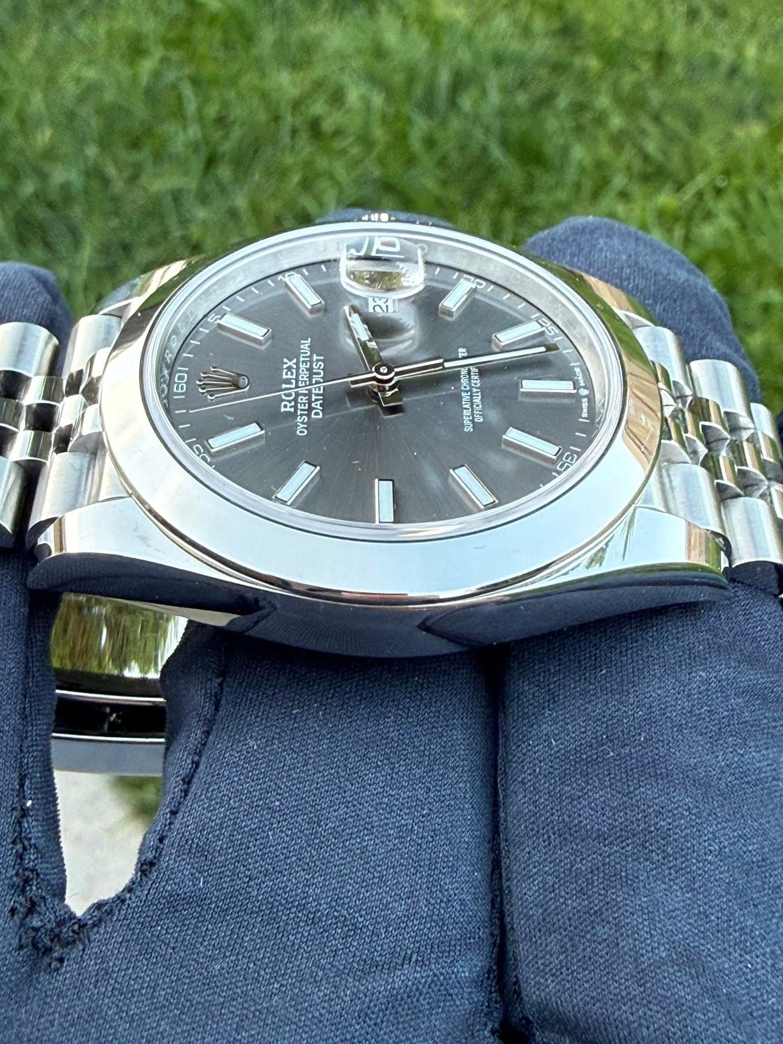 May be an image of wrist watch and text that says '生 ك2 0 ا P 60 1 05 TUAL ROLEX OYSTER OYST JUST DATEJUST DATE ㅁ UPERLATMEDE OFFCALLTCERTE 05 M ผ 135'