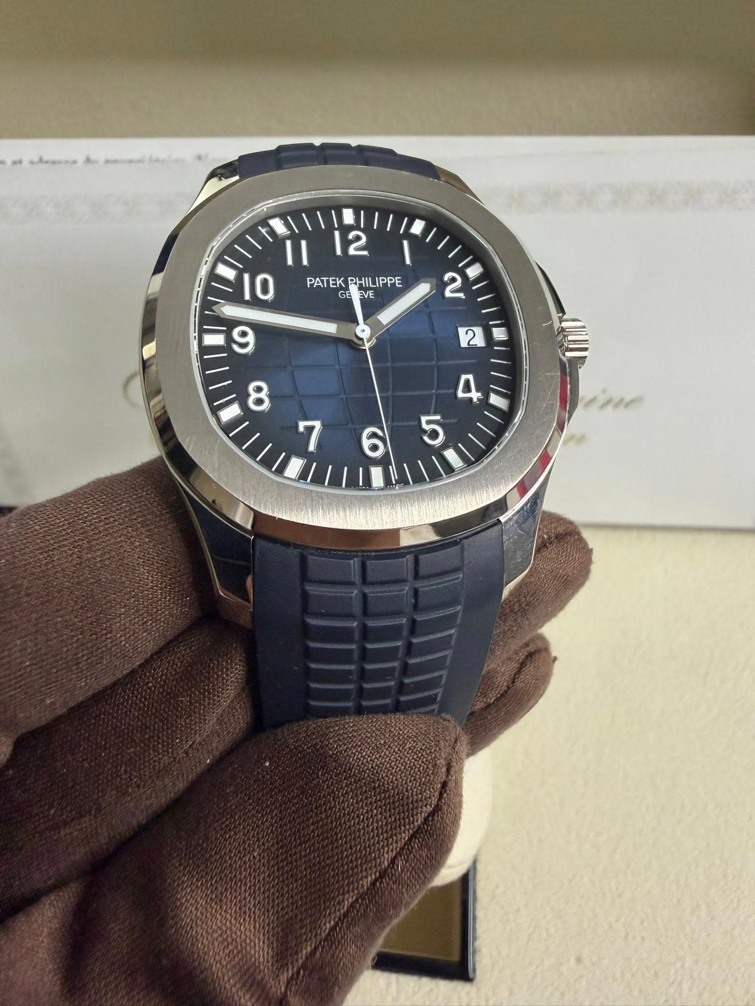 May be an image of wrist watch and text that says '12 Ⅱ I 10 PATEK PHILIPPE EVE م 765 6 5'
