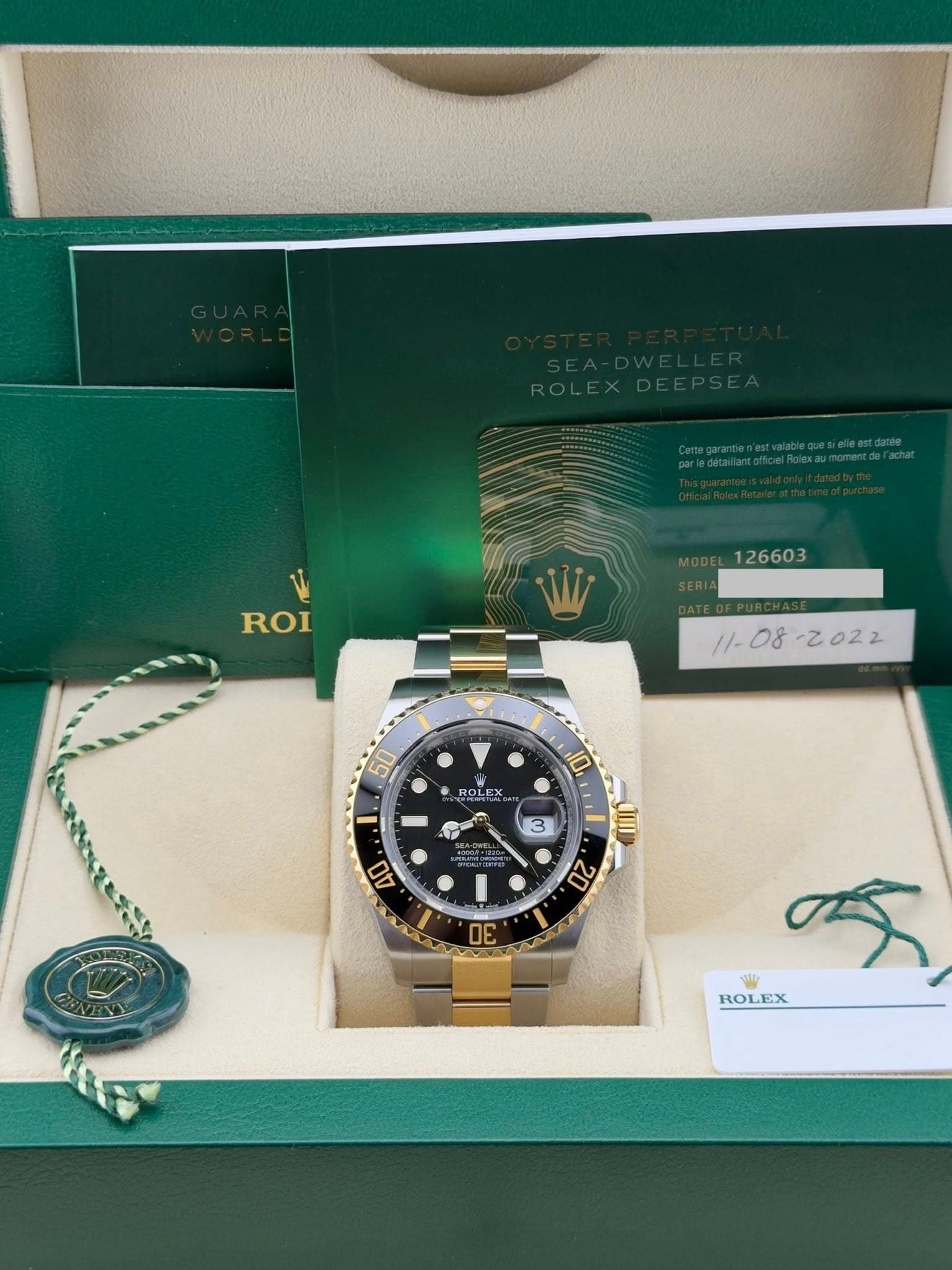 May be an image of wrist watch and text that says 'ROI //- ROLEX ាគណដៃ 10 3 AO CIII 20 30 14 ROLEX ROLE'