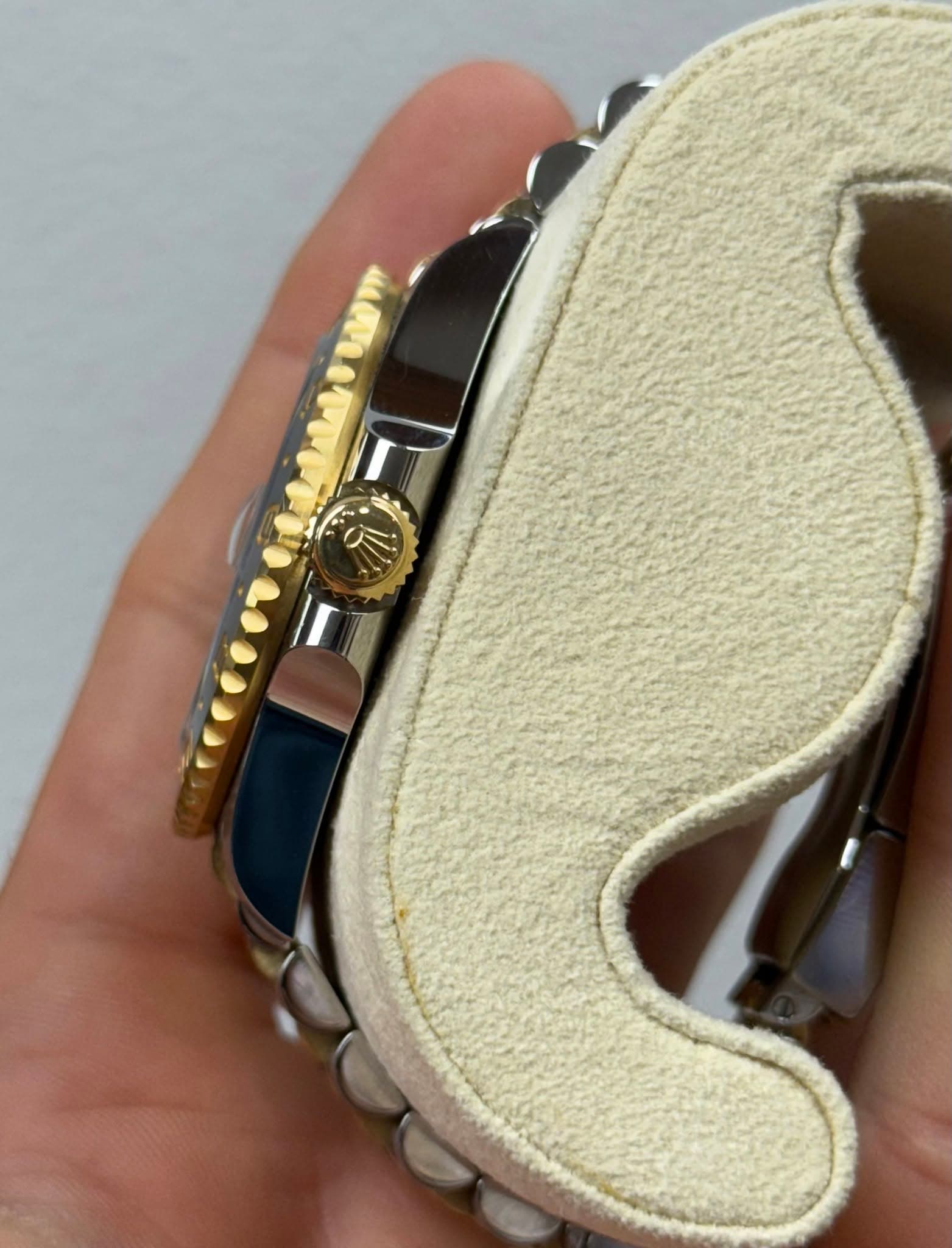 May be an image of wrist watch and saddle-stitched leather