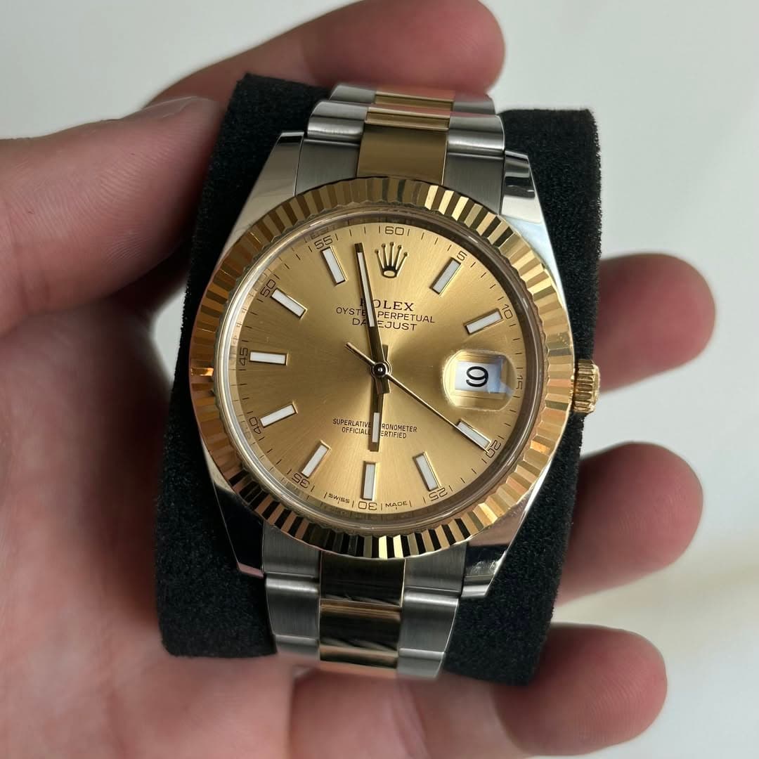 May be an image of wrist watch and text