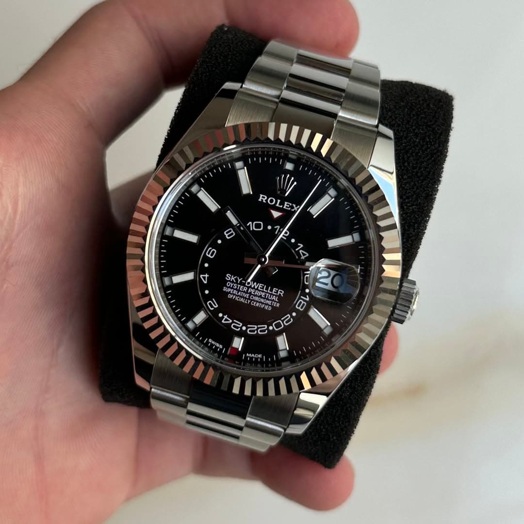 May be an image of wrist watch and text