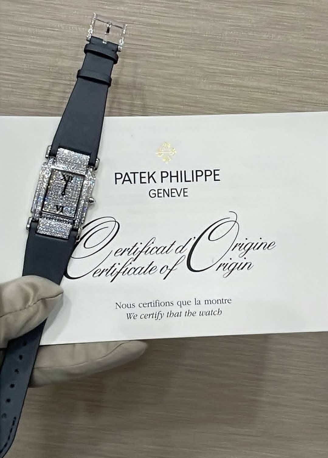 May be an image of digital watch and text that says 'PATEK PATEKPHILIPPE PHILIPPE GENEVE Oryfinaid Qhin ertificald Chin rigin ertificale Nous certifions que la montre We certify…
