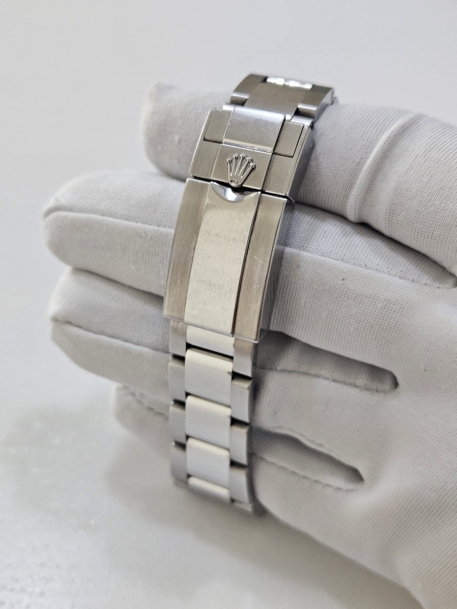May be an image of wrist watch, jewelry and text