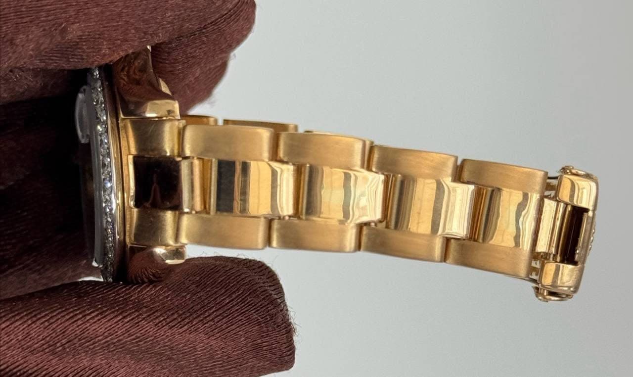 May be an image of wrist watch and text