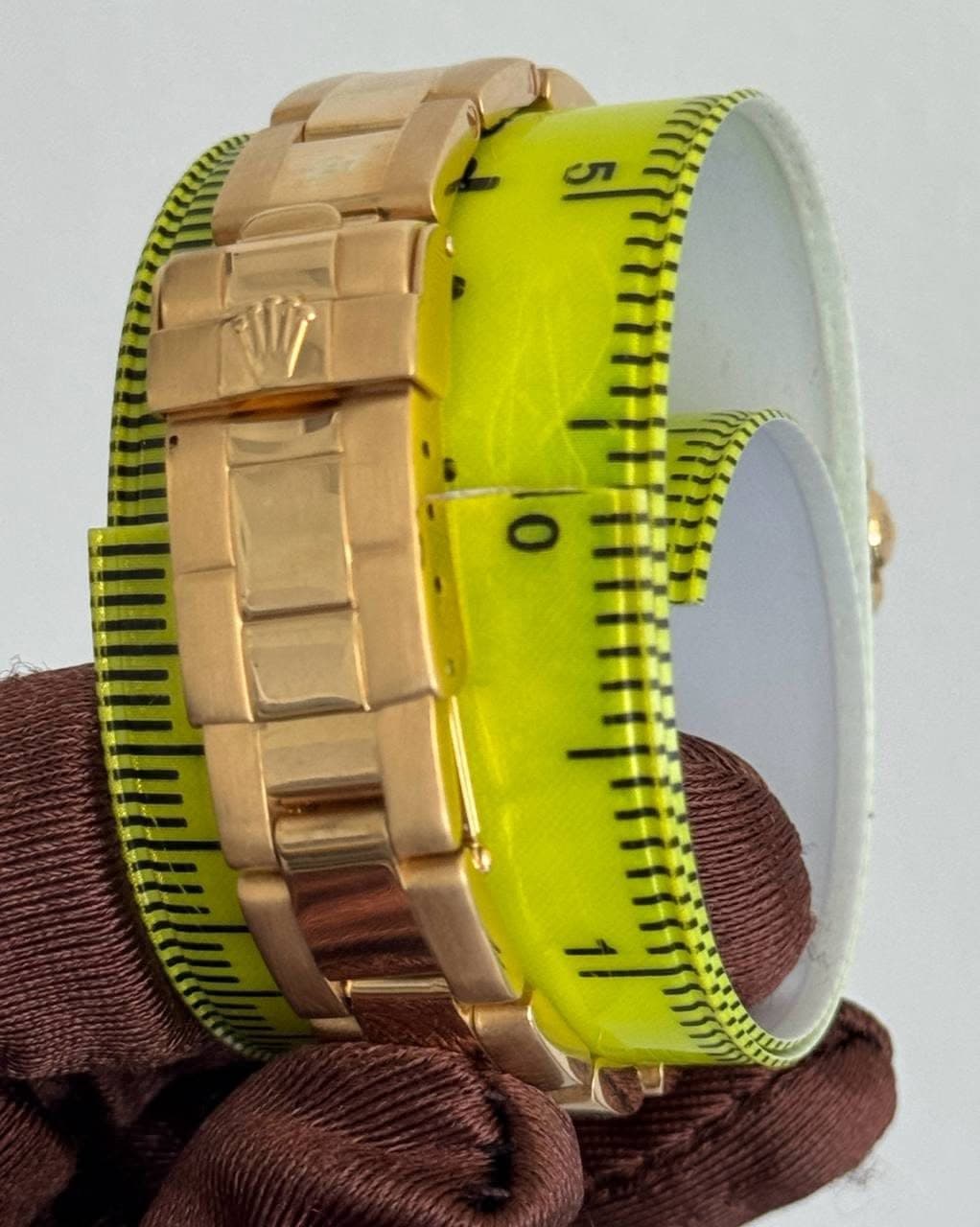May be an image of wrist watch, measuring stick and text