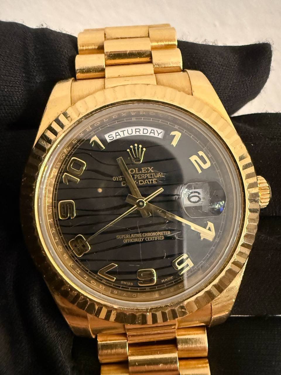 May be an image of wrist watch and text