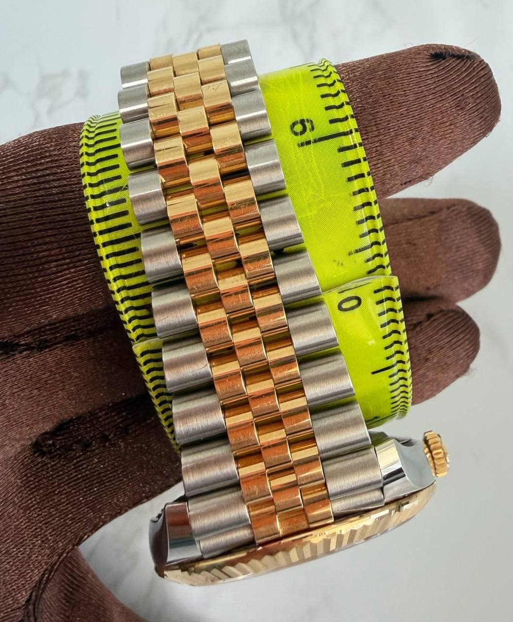 May be an image of wrist watch and text