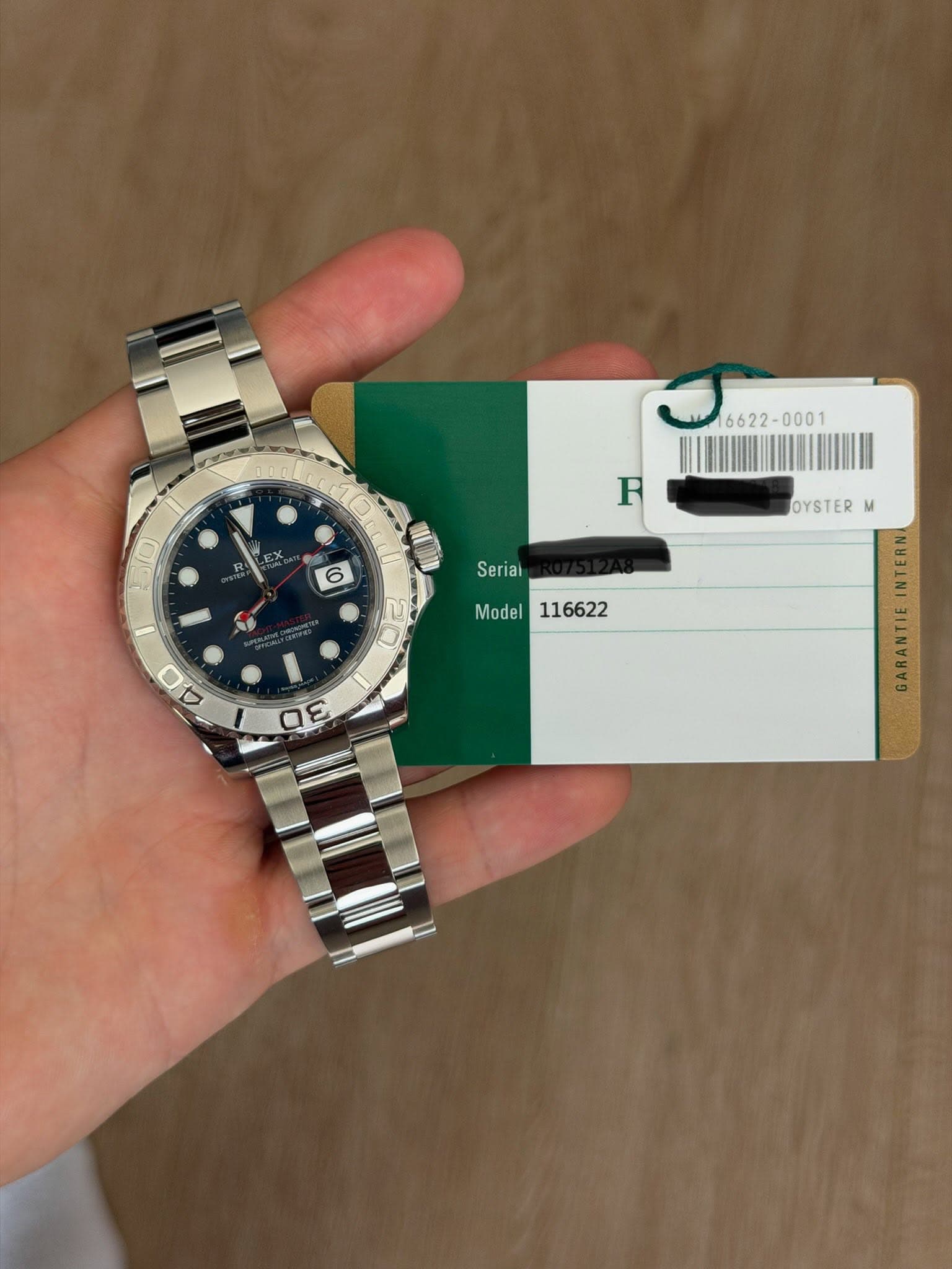 May be an image of wrist watch and text that says ' EX 50 F 6 0 Seriai Model116622 Model OYSTER M E E 3'