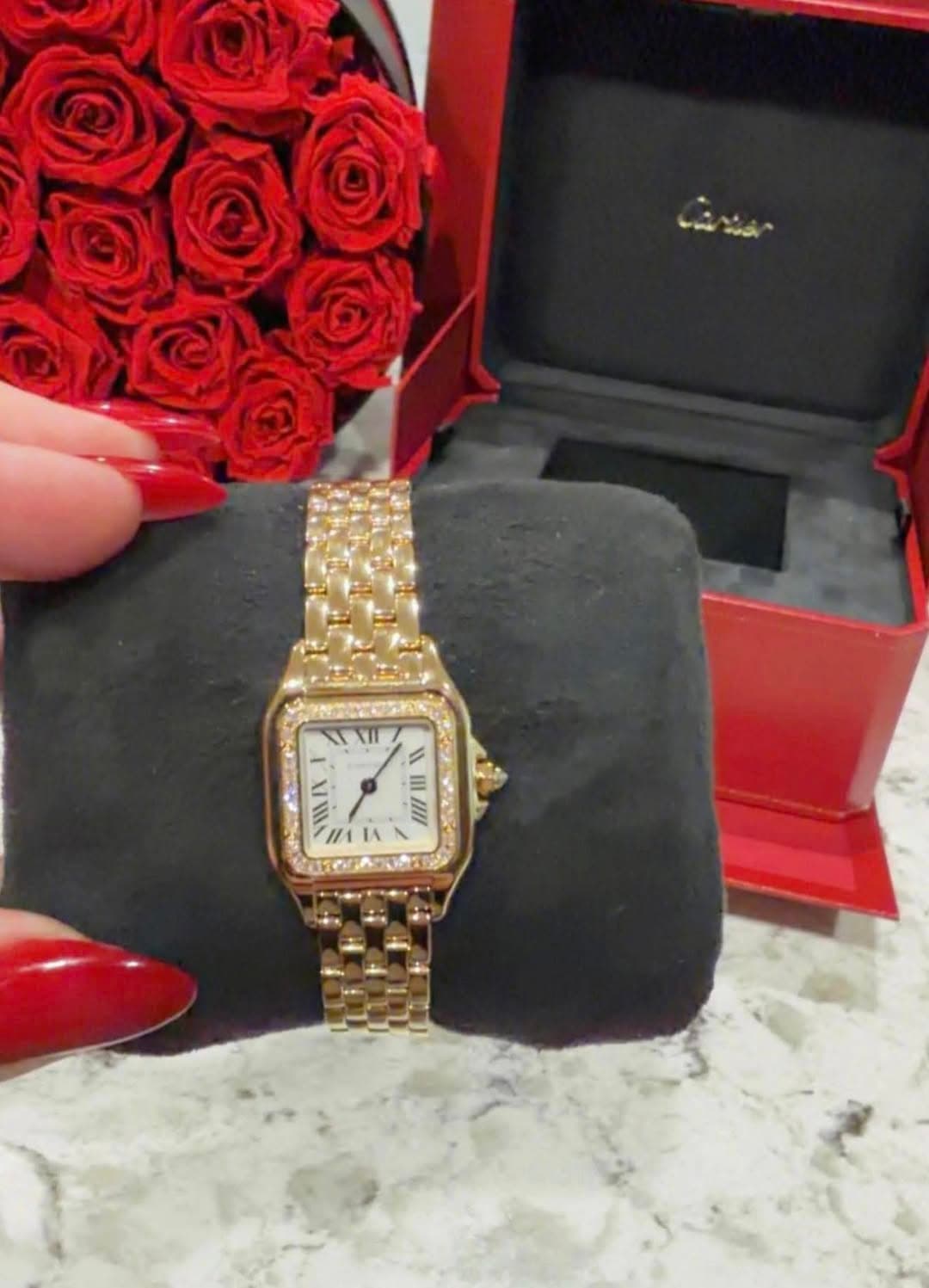 May be an image of wrist watch and text