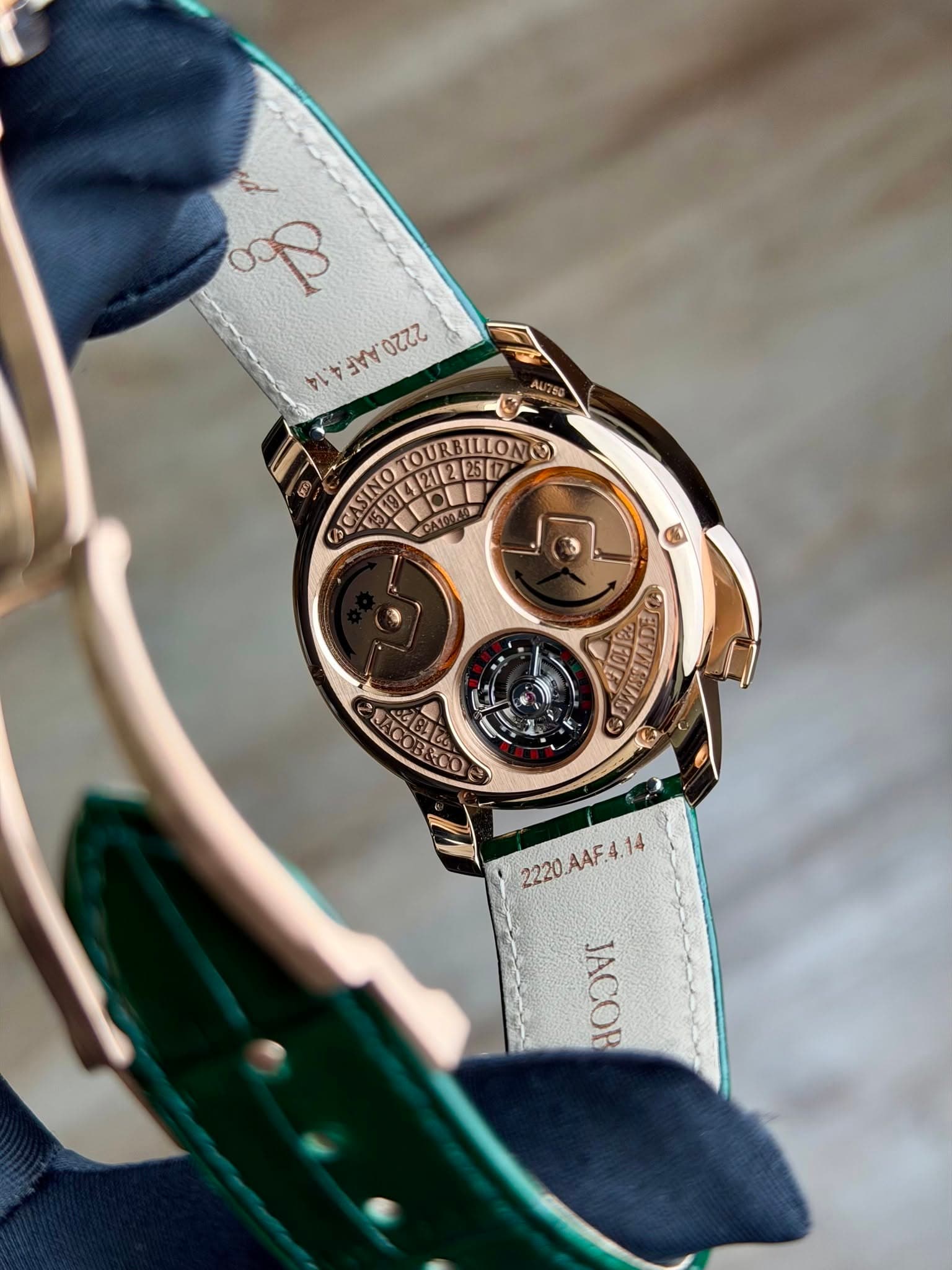 May be an image of wrist watch and text that says 'ထ၃ م 2AA 2200 AU750 TOURBILLON CASINO CATOO, SINO E . A4F4 2220.A4F.4.14 14 JACOR'