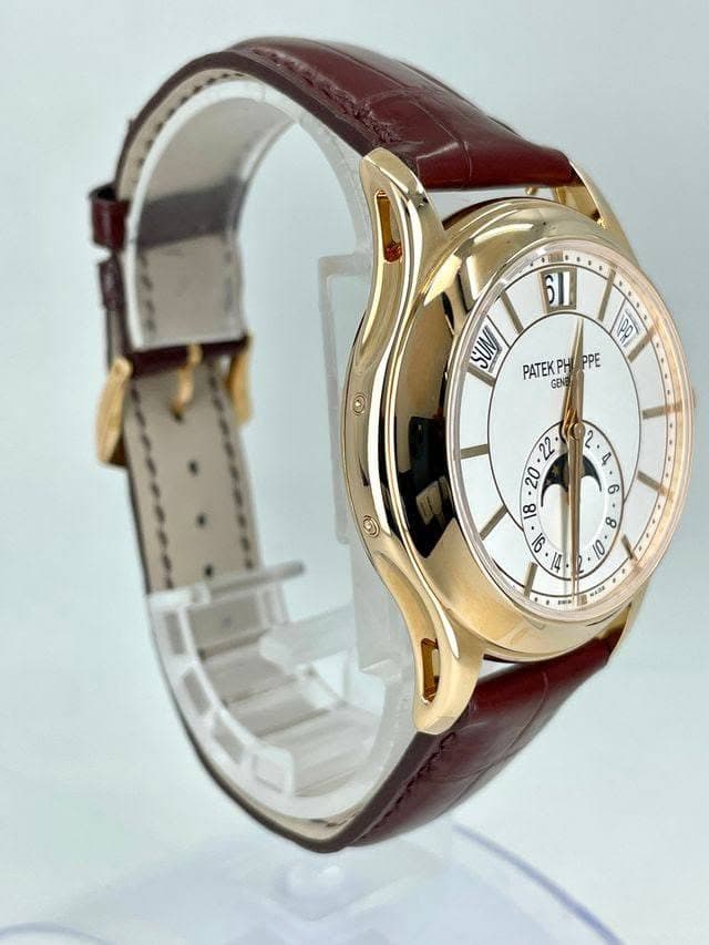 May be an image of wrist watch and text that says '61 SUN 1Do PATEKPH PATEKPHPPE PPE GENE GEN অ ت 22 بي O き酒 ま PA ሞ//'