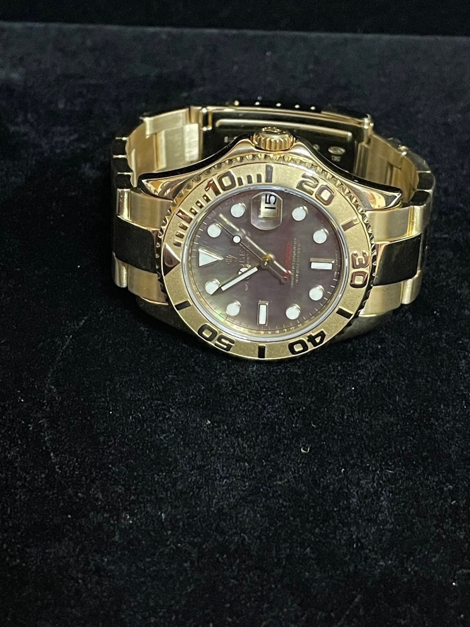 May be an image of wrist watch and text