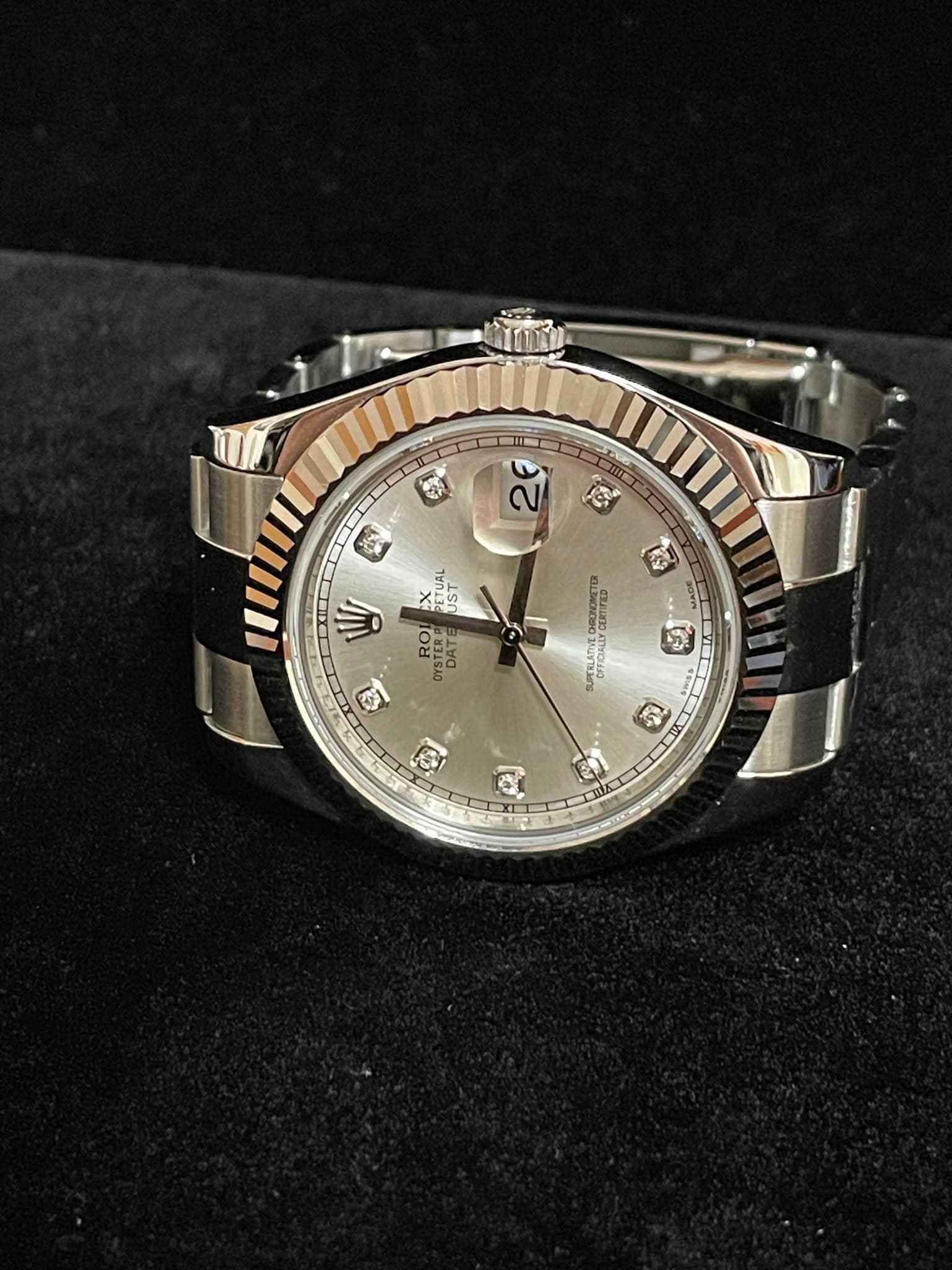May be an image of wrist watch and text