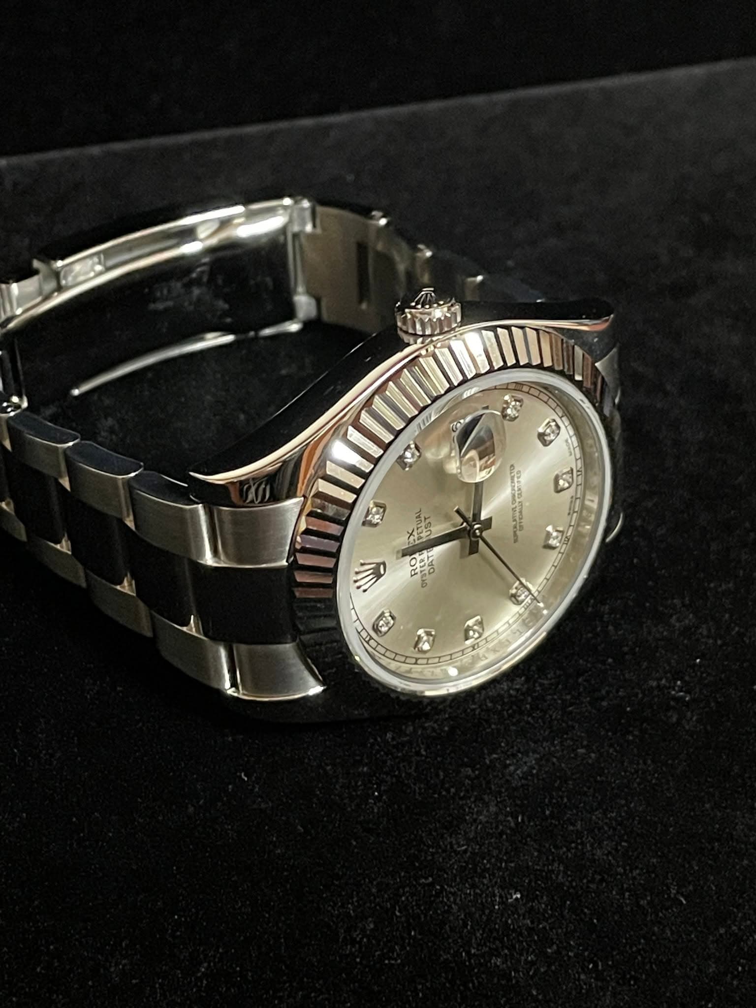 May be an image of wrist watch and text