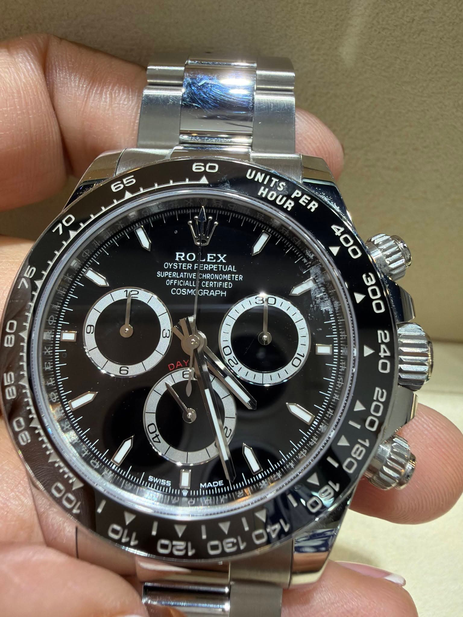 May be an image of wrist watch and text