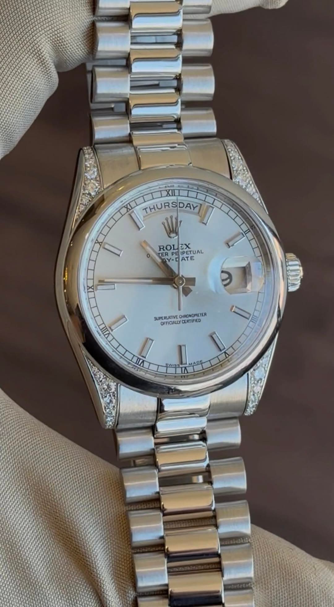 May be an image of wrist watch and text