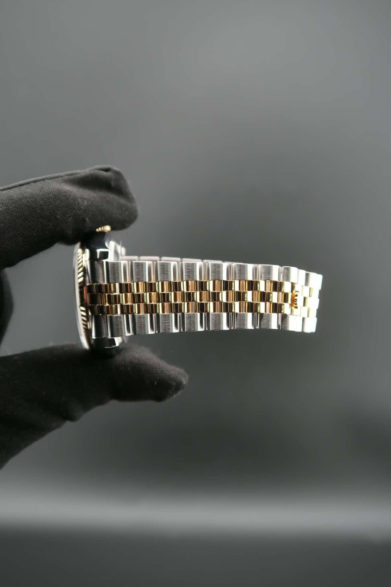May be an image of wrist watch