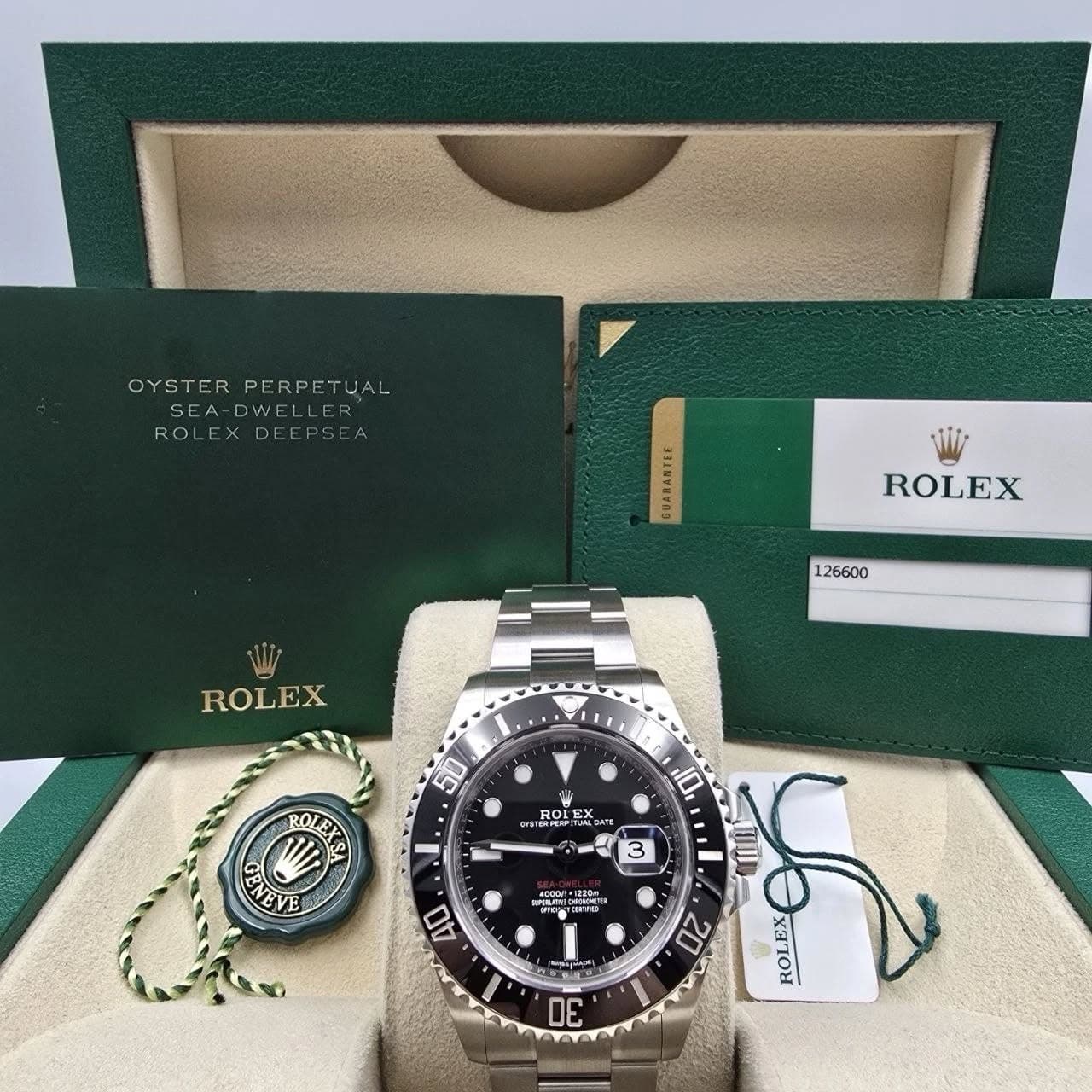 May be an image of wrist watch and text that says 'OYSTER PERPET OYSTERPERPETUAL UAL SEA SEA-DWEL DWEL ROL ROLEXDEE DEE GUARANTEL ROLEX 126600 ROLEX 50 小 YETAPEO GAT SATE U EX ዐ…