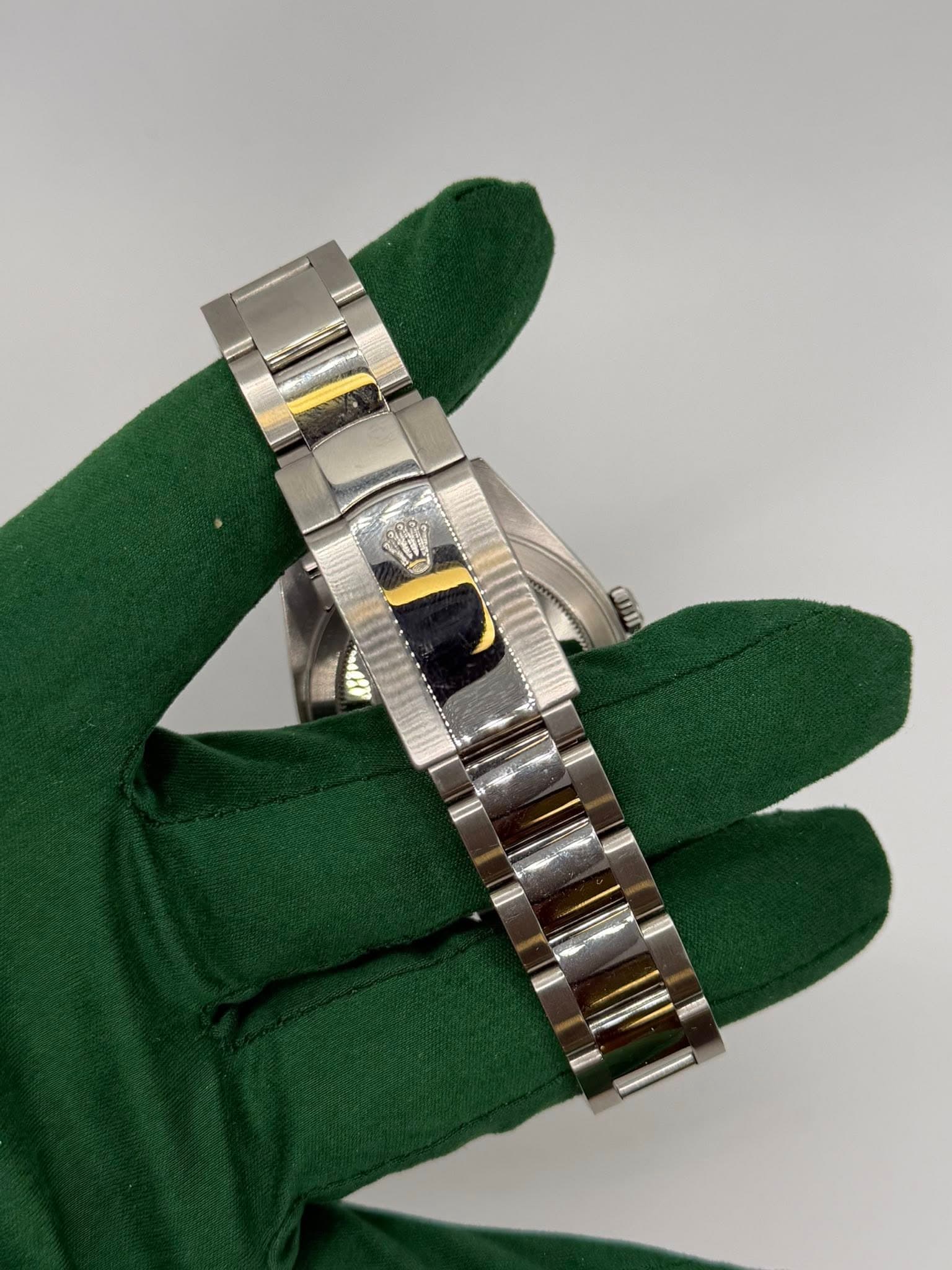 May be an image of wrist watch and text