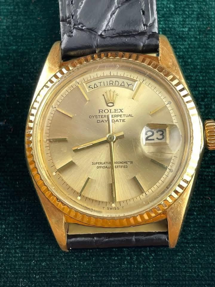 May be an image of wrist watch and text