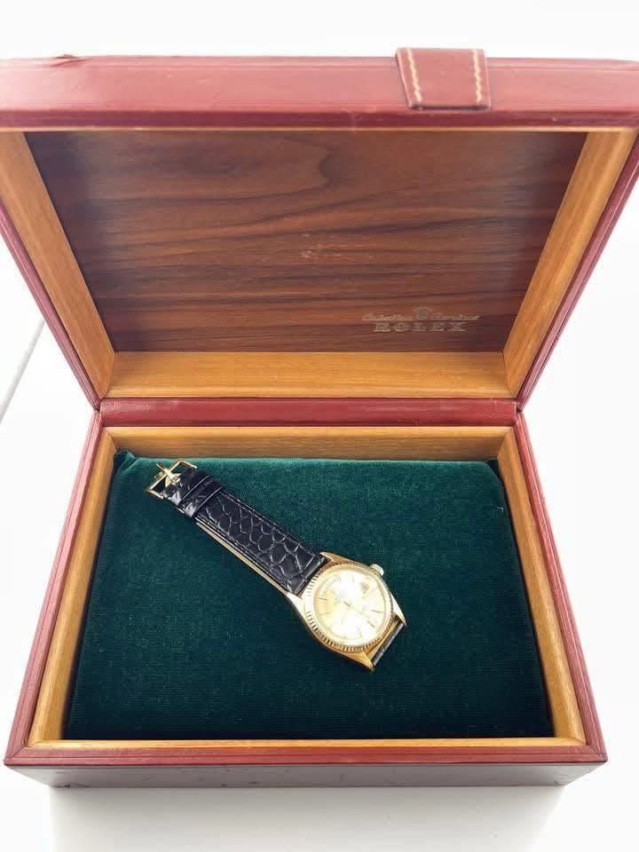 May be an image of wrist watch and text