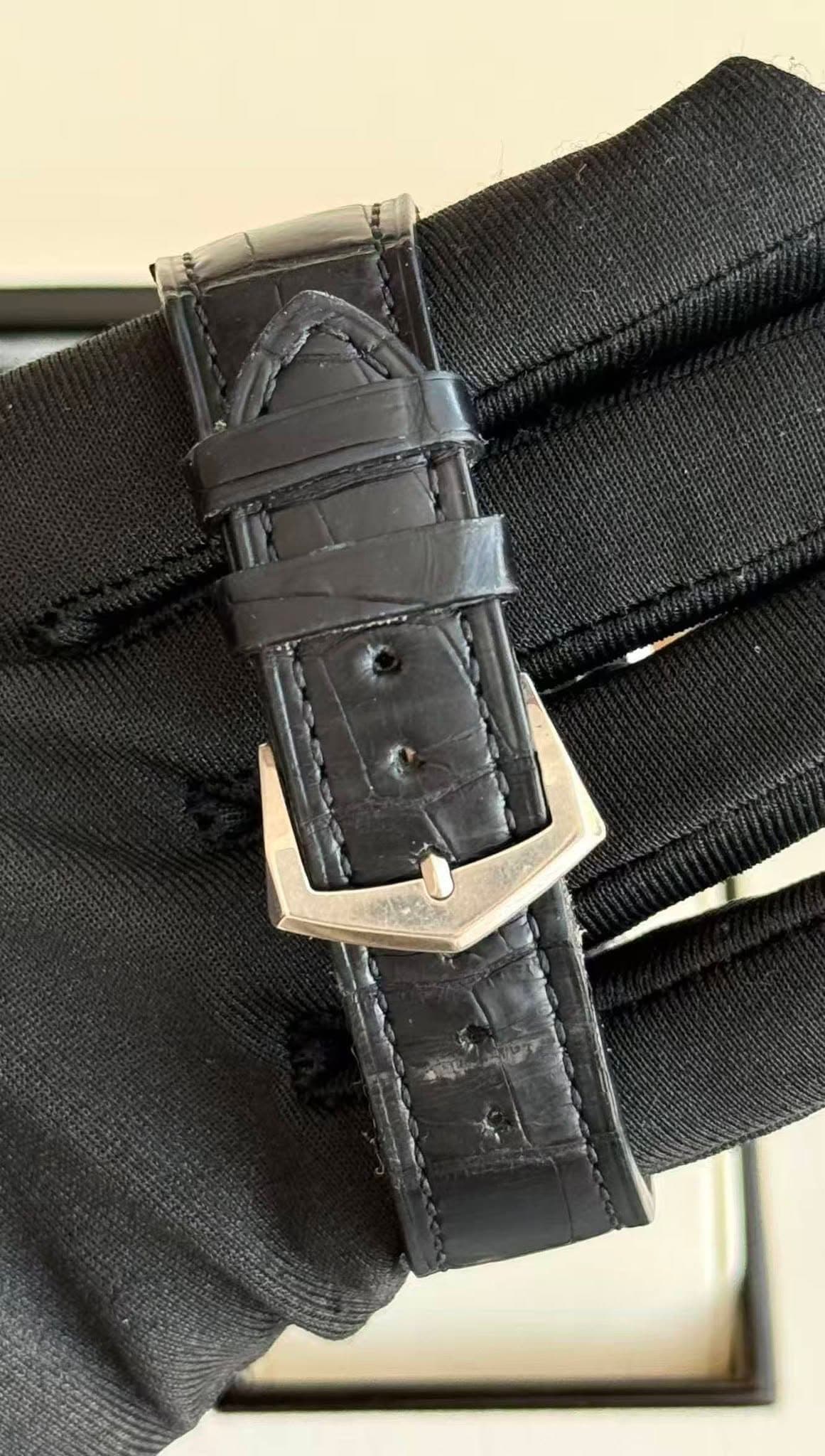 May be an image of leather, saddle-stitched leather and wrist watch