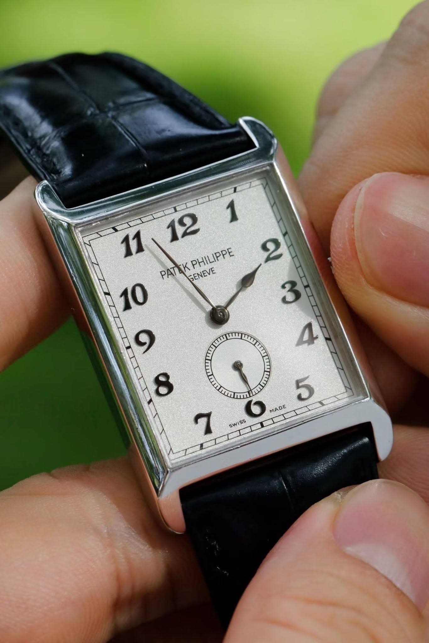 May be an image of wrist watch and text that says ' PAT PATEKPHILIPPE K PHILIPPE GENEVE LIT7 m tn THTM W m ቀሽ 5 MADE SWISS'