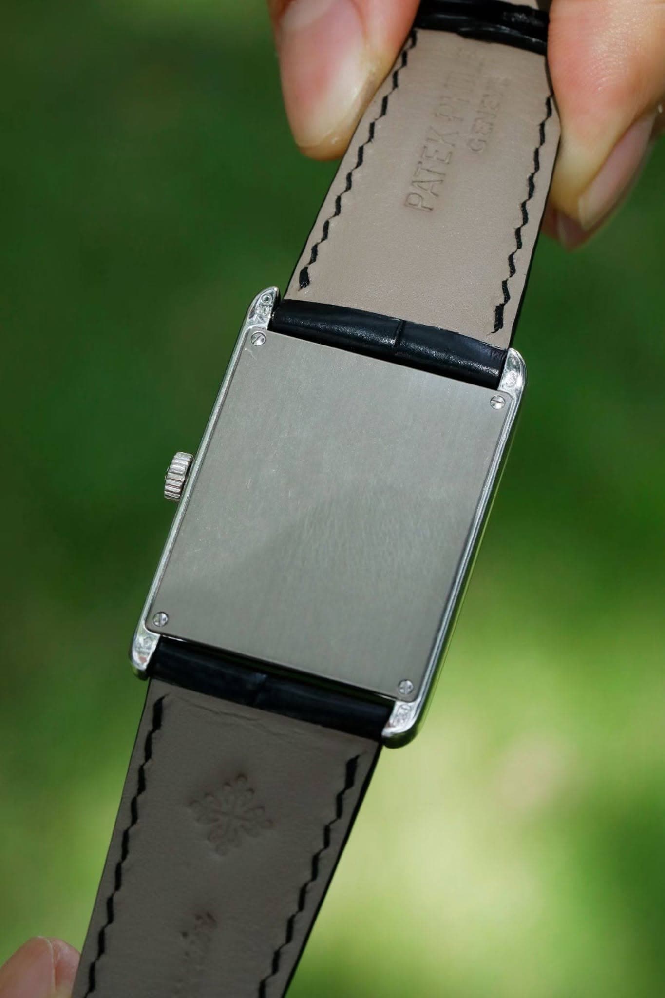 May be an image of leather, saddle-stitched leather and digital watch
