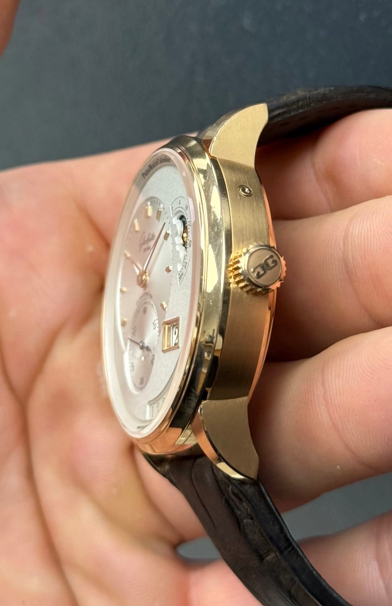 May be an image of wrist watch and text