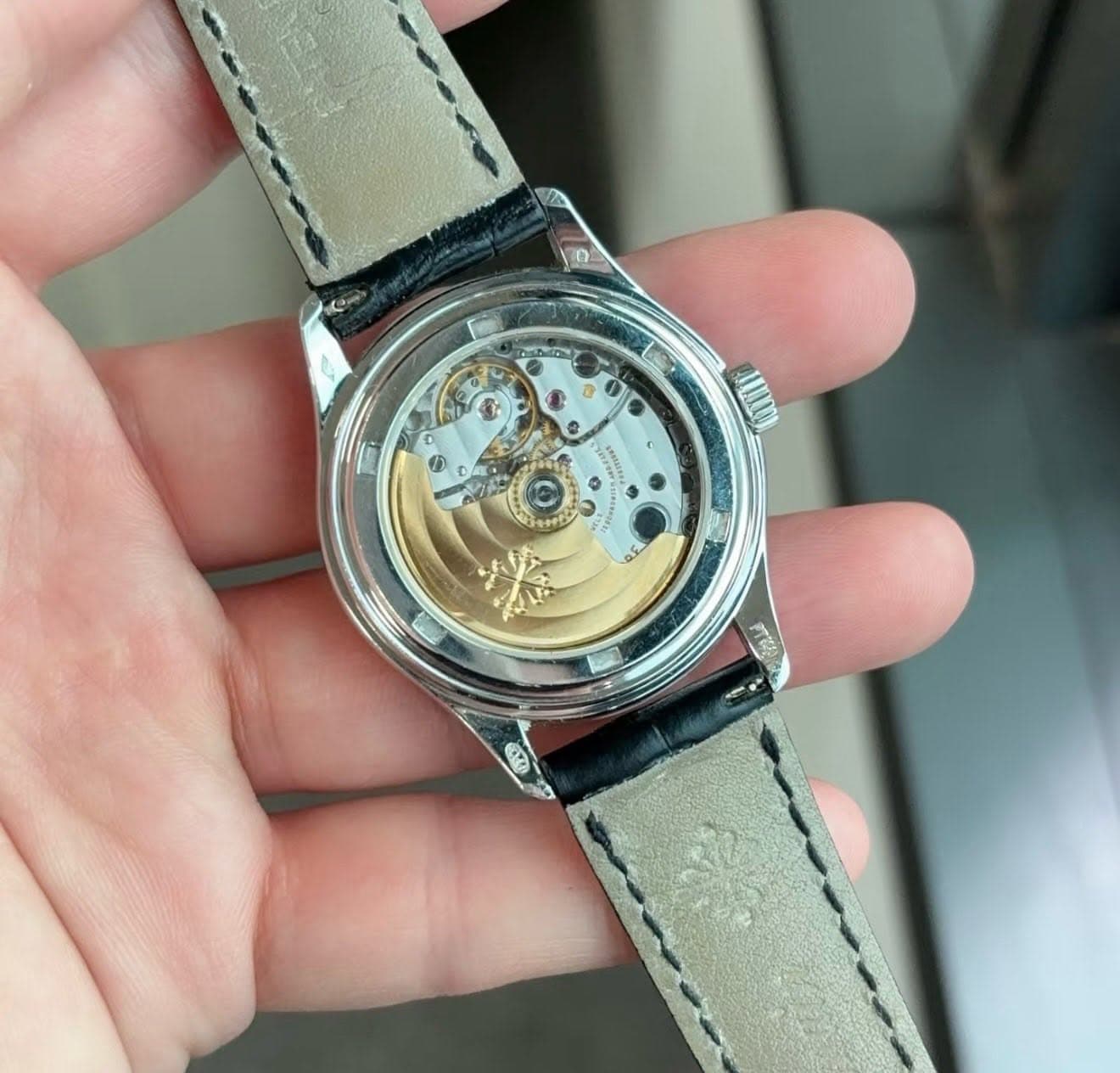 May be an image of wrist watch and text