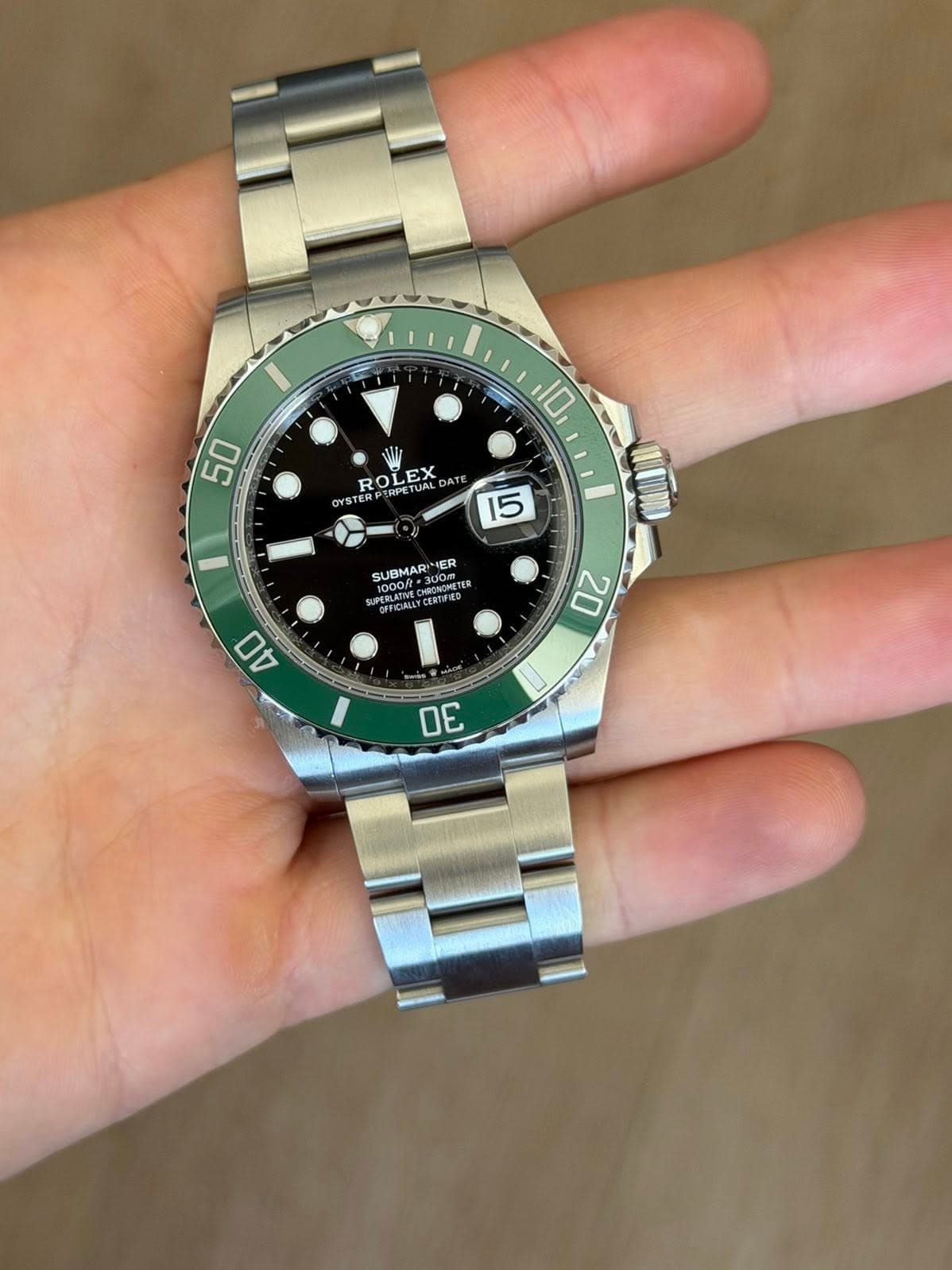 May be an image of wrist watch and text