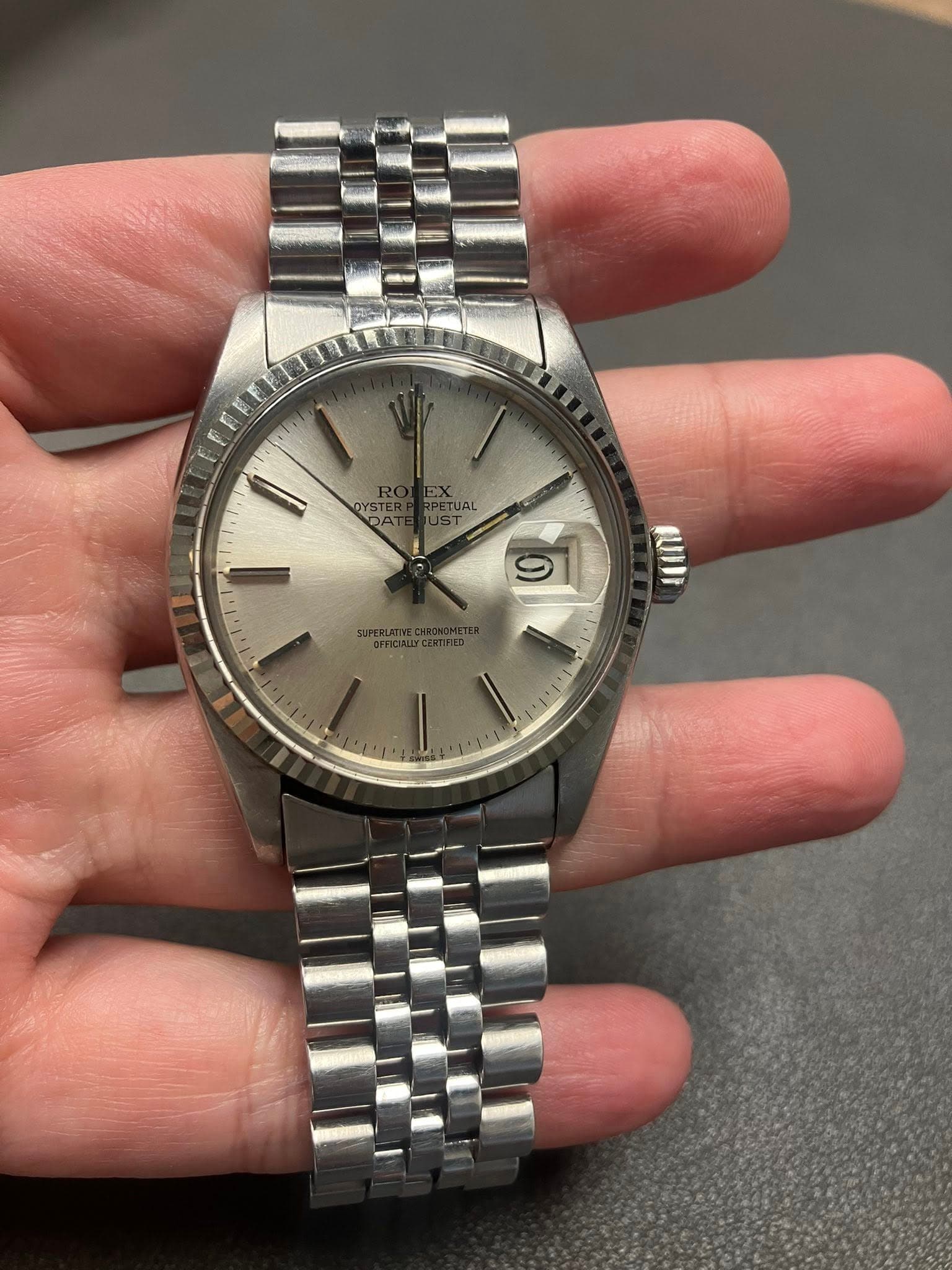 May be an image of wrist watch and text