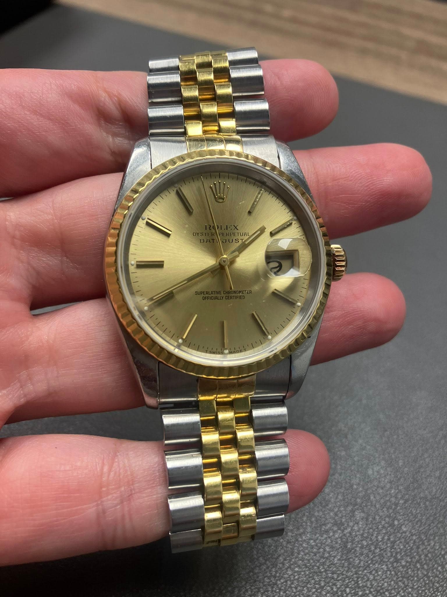 May be an image of wrist watch and text