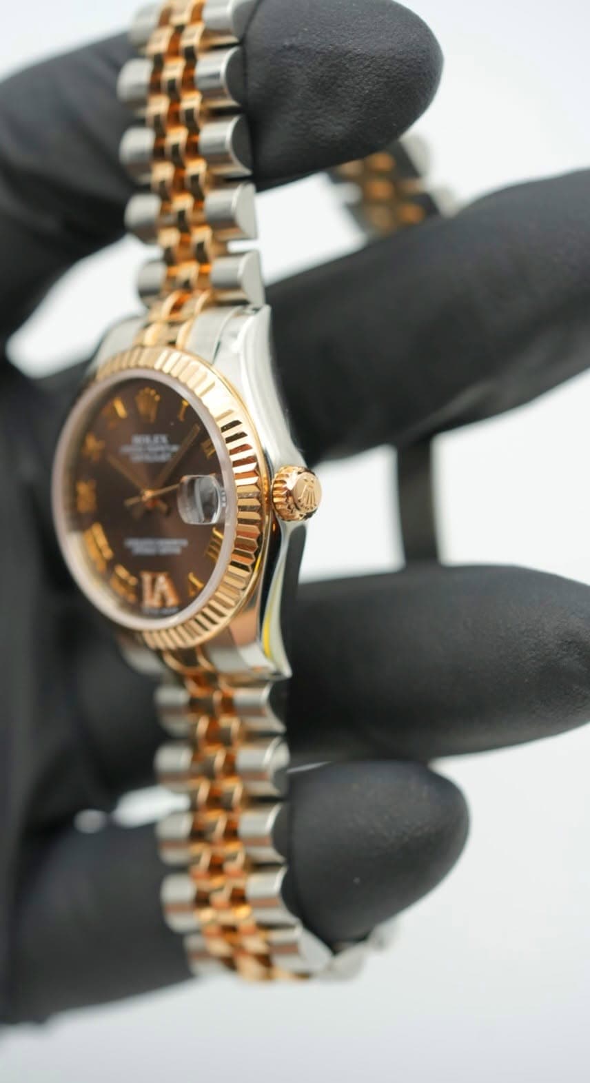 May be an image of wrist watch and text