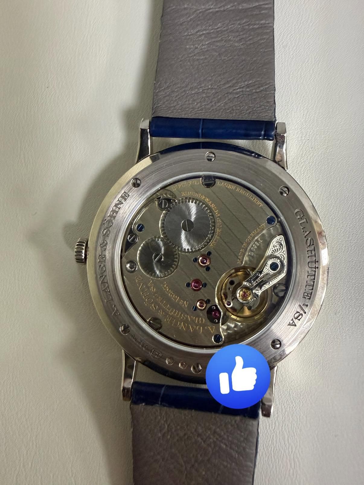 May be an image of wrist watch and text