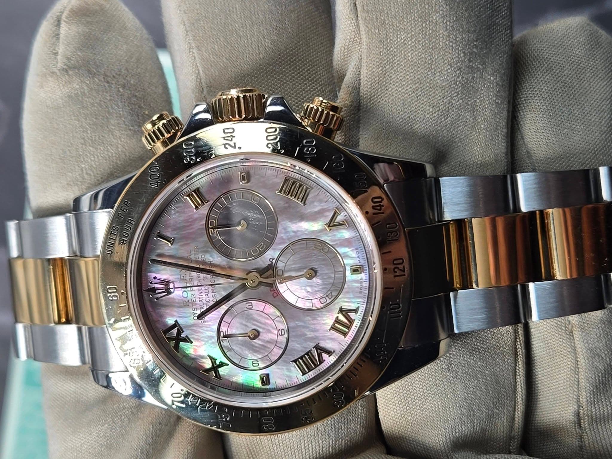 May be an image of wrist watch and text