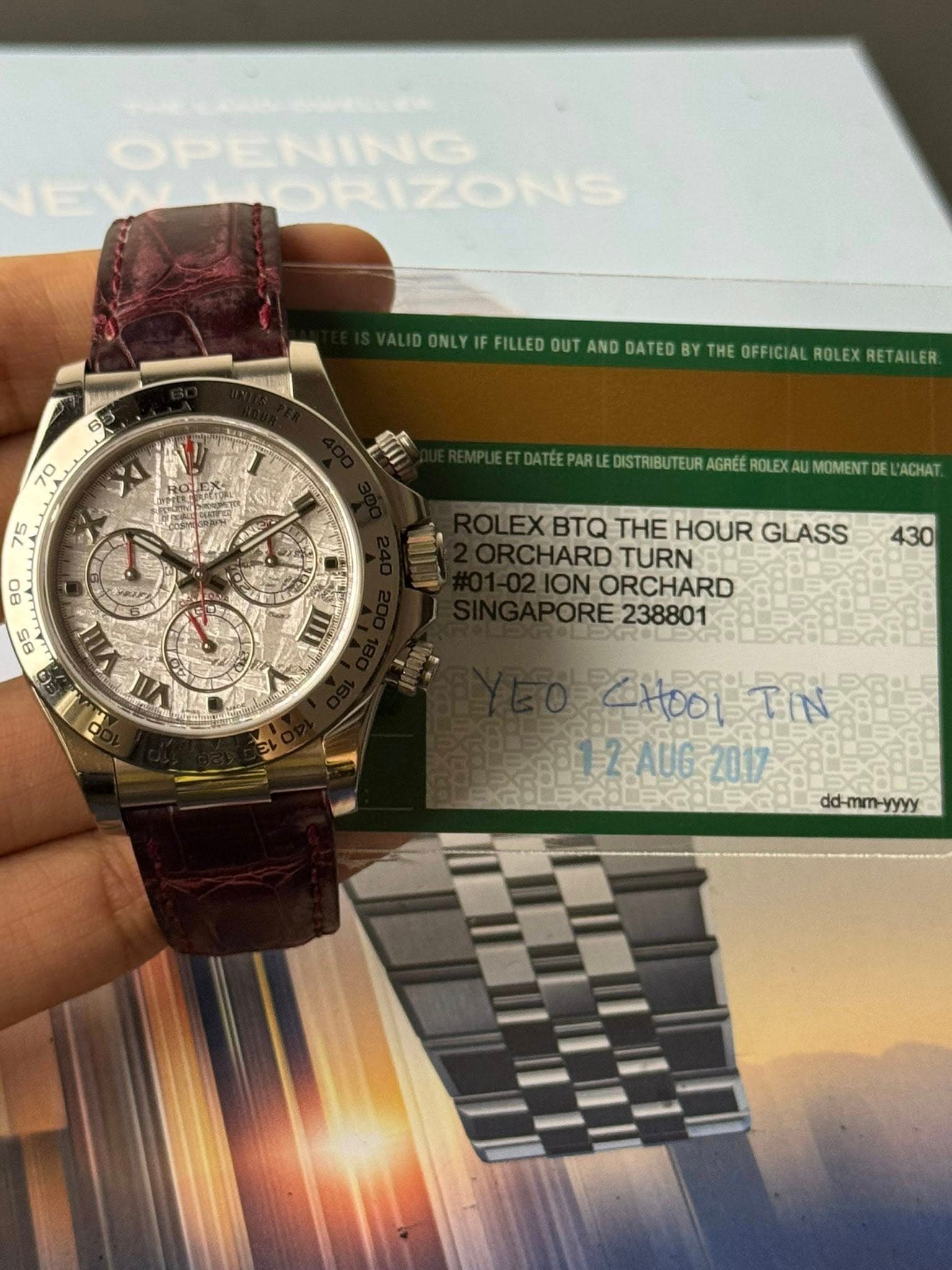 May be an image of wrist watch and text