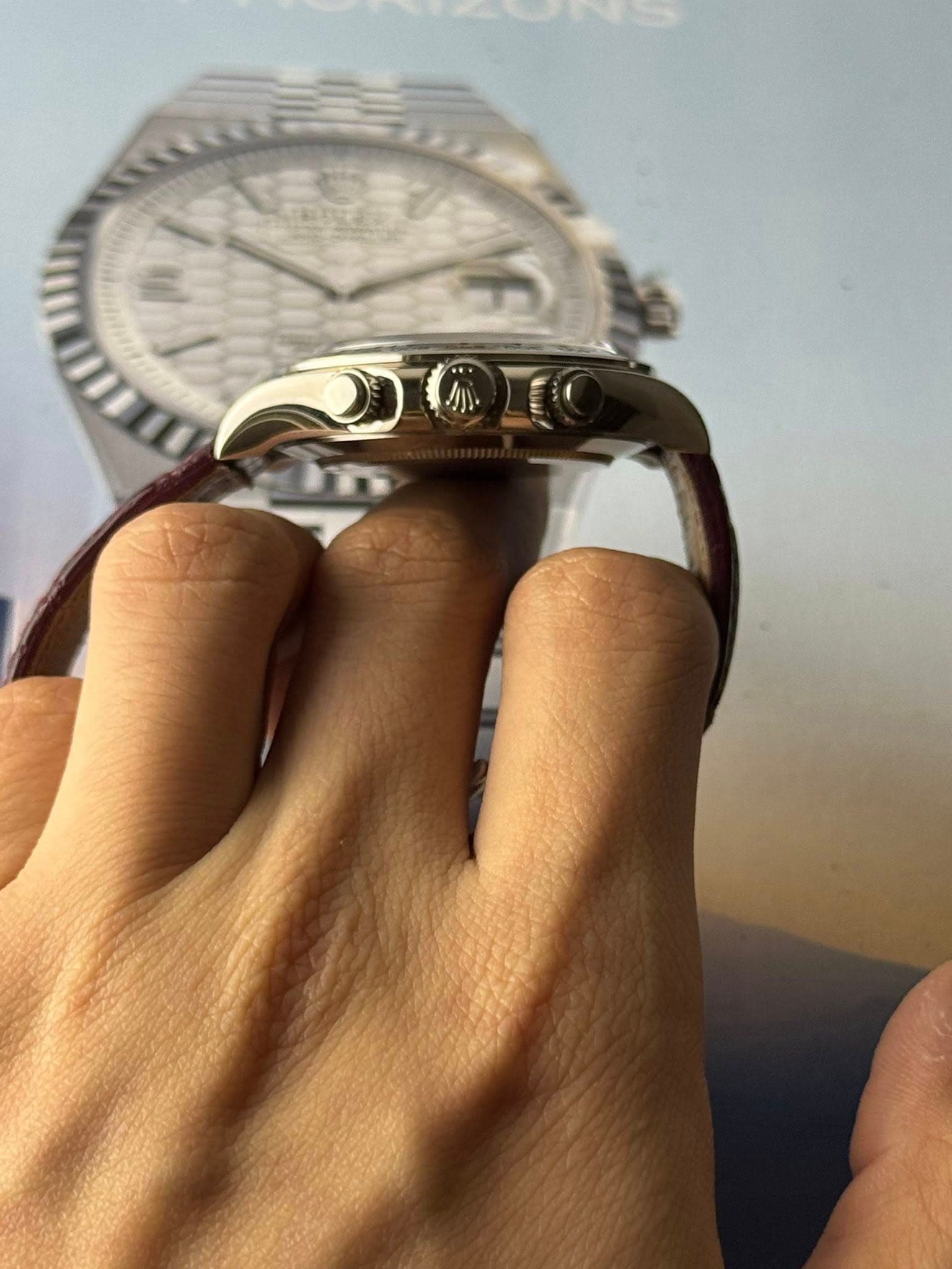 May be an image of wrist watch and text