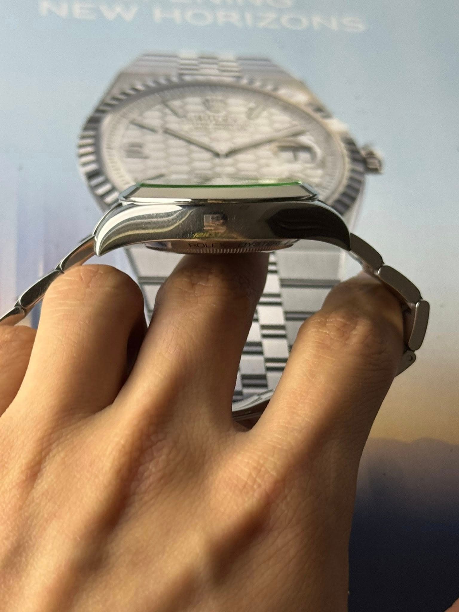 May be an image of wrist watch and text