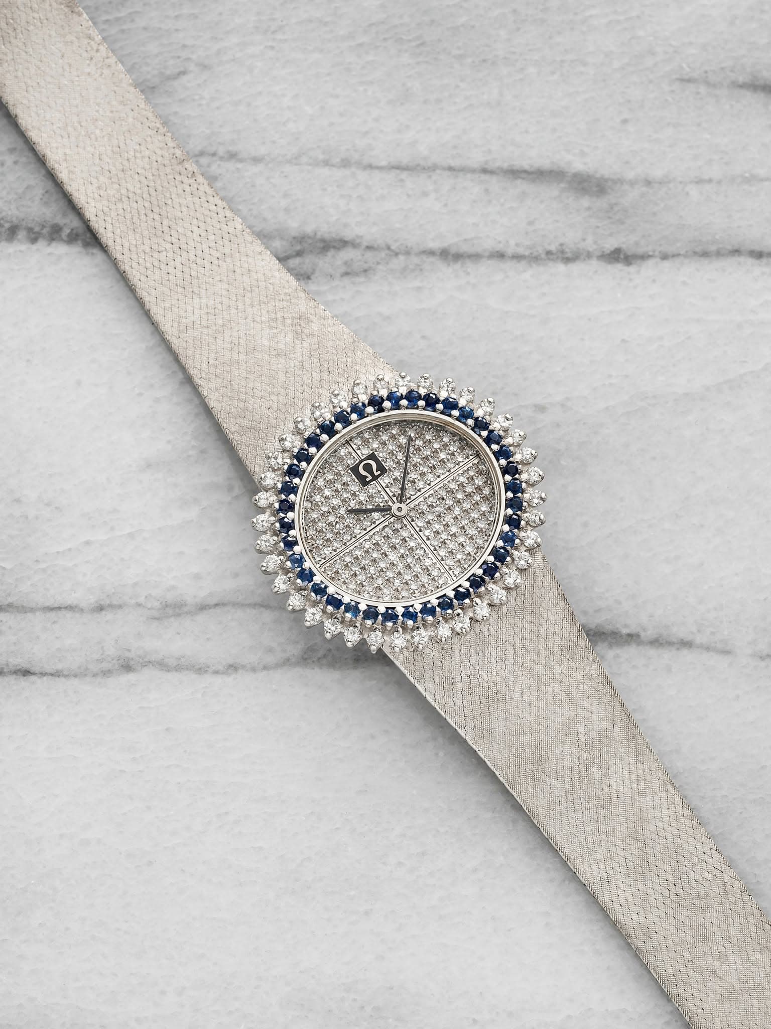 May be an image of wrist watch and jewelry