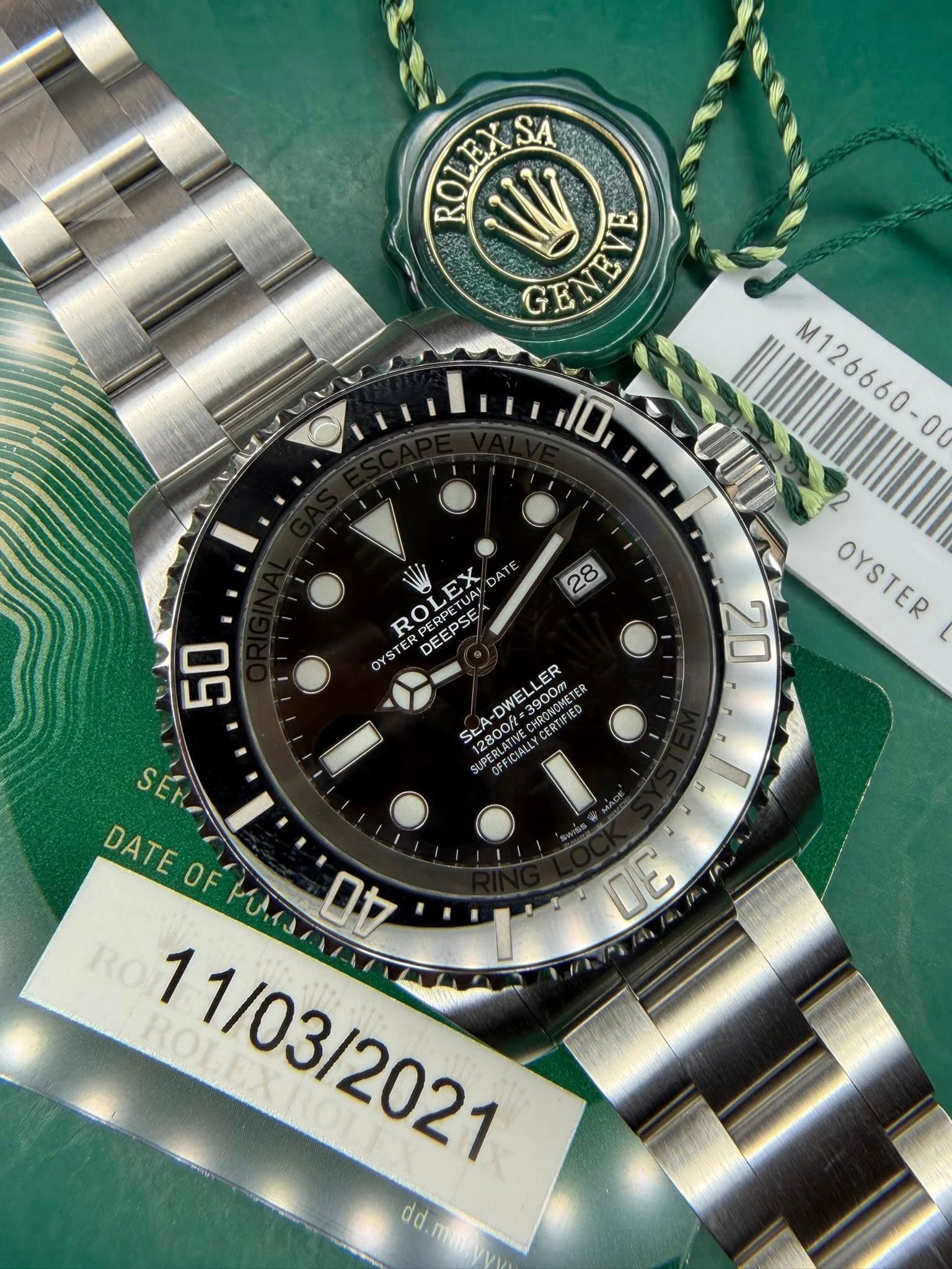 May be an image of wrist watch and text that says 'ROLEXS SA 台商 ROLE GENEVE D 28 50 M126660-0 00 UUD OYSTER OYSTER 20 Q 명 EX TE ROL PERPEE OYSTE DE DEEPSE ROLEX ERPETUA TUAI UAI…